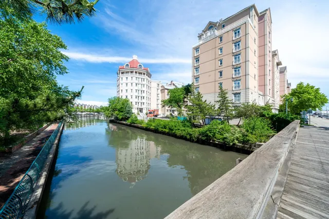 a view of a lake with building and outdoor space