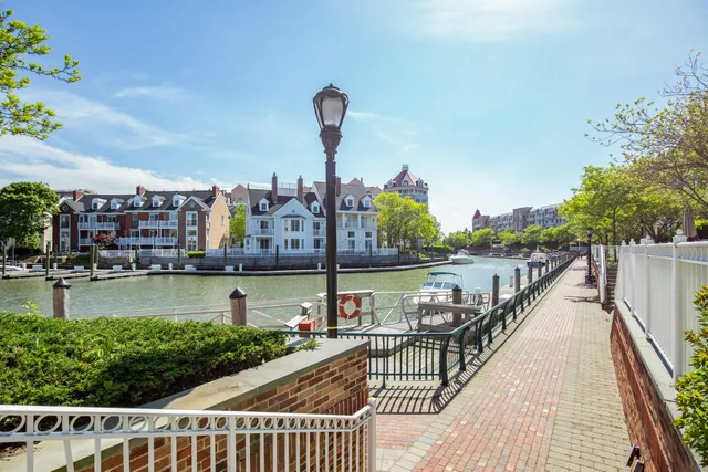a view of a lake with a table and chairs
