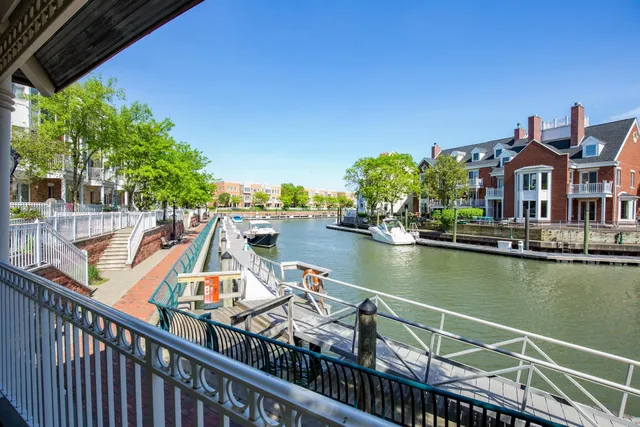 a view of a patio with table and chairs under an umbrella