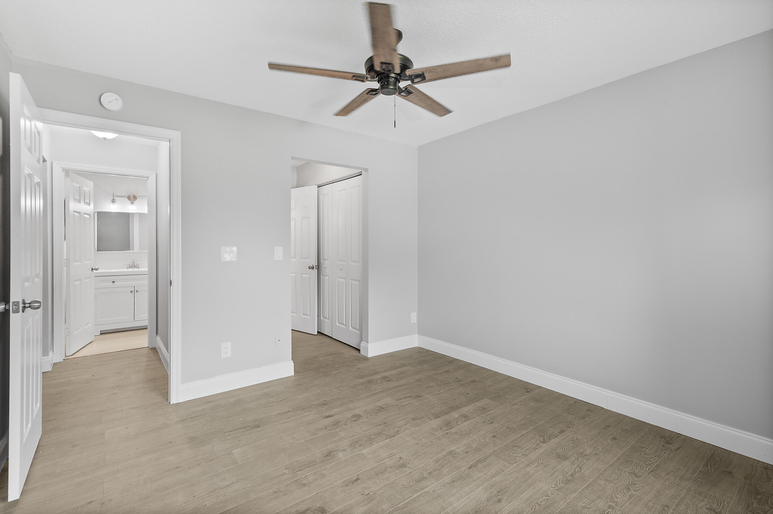 4777 Southeast Salvatori Road Stuart, FL 34997 - Photo 12 of 28 wooden floor in an empty room