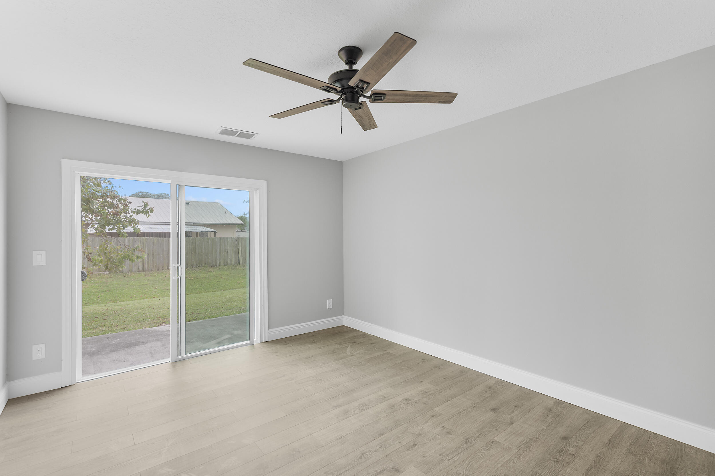 4777 Southeast Salvatori Road Stuart, FL 34997 - Photo 20 of 28 a view of a livingroom with a ceiling fan and window