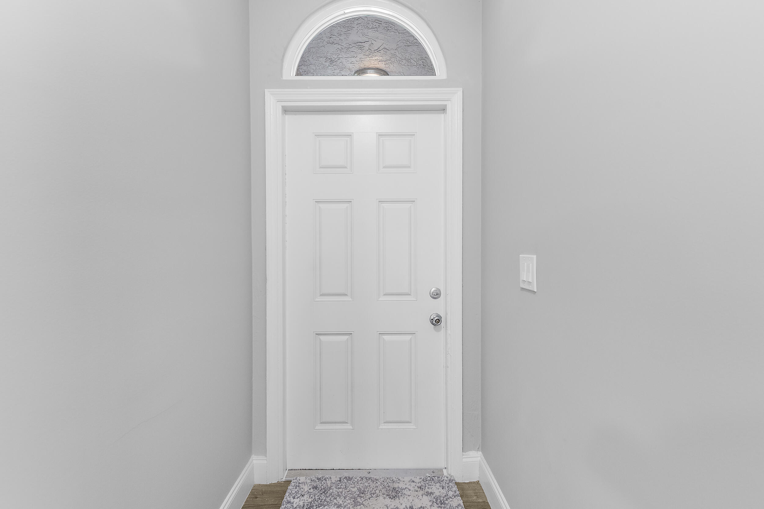 4777 Southeast Salvatori Road Stuart, FL 34997 - Photo 25 of 28 a view of a hallway with front door