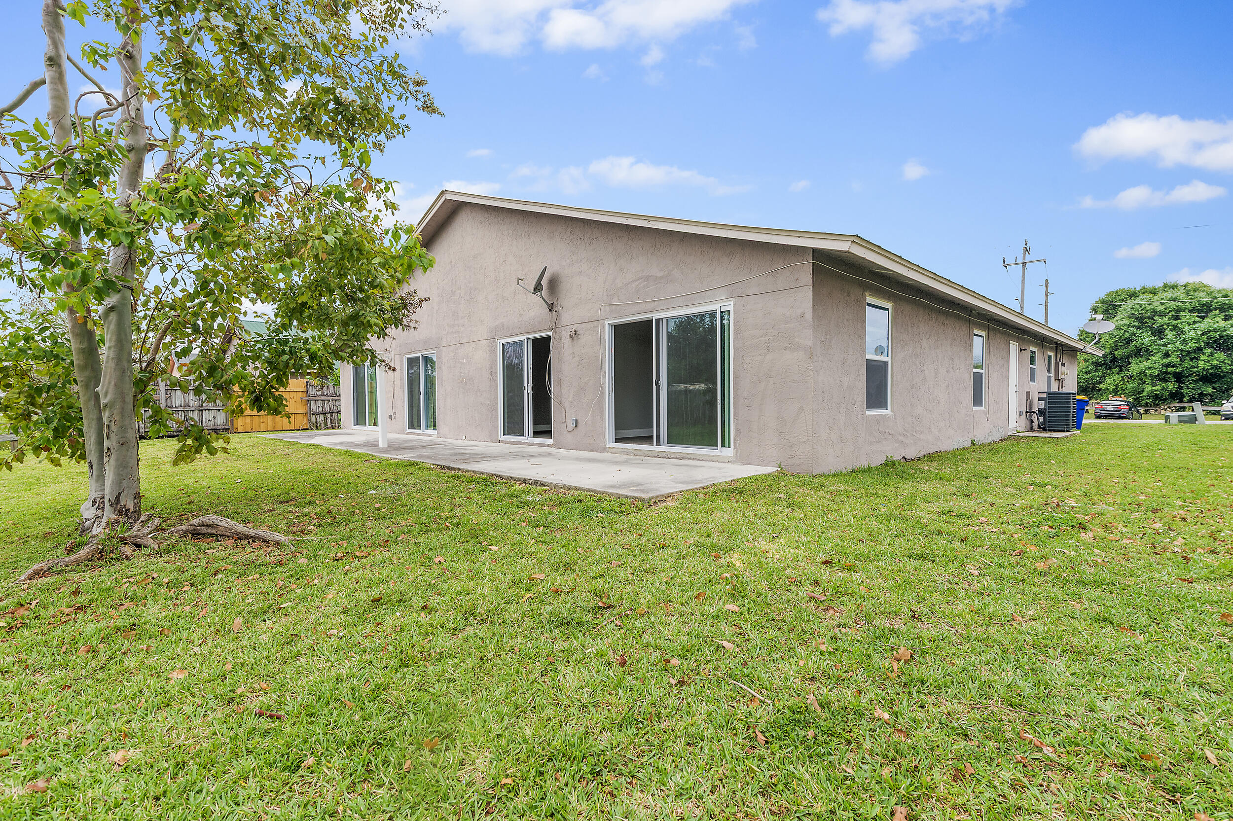 4777 Southeast Salvatori Road Stuart, FL 34997 - Photo 26 of 28 a view of a house with backyard