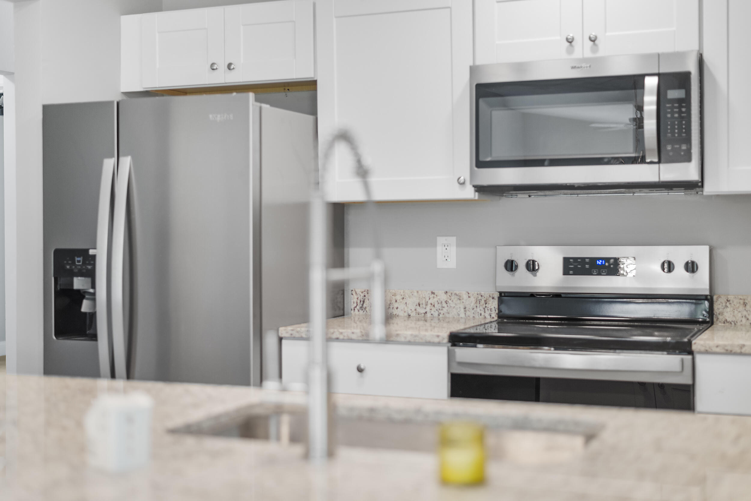 4777 Southeast Salvatori Road Stuart, FL 34997 - Photo 5 of 28 a kitchen with stainless steel appliances a refrigerator and a microwave
