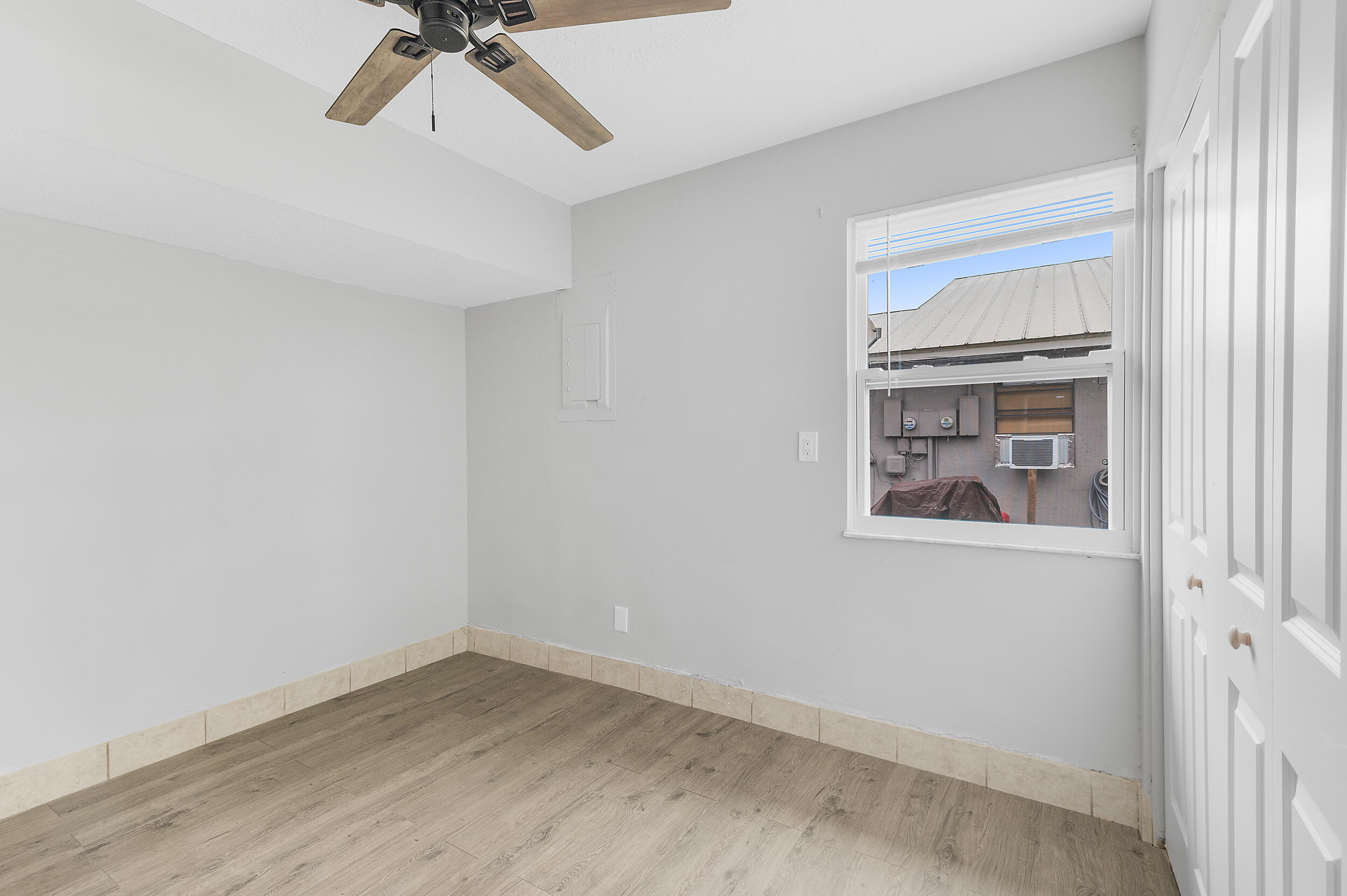 4777 Southeast Salvatori Road Stuart, FL 34997 - Photo 9 of 28 a view of an empty room with a window