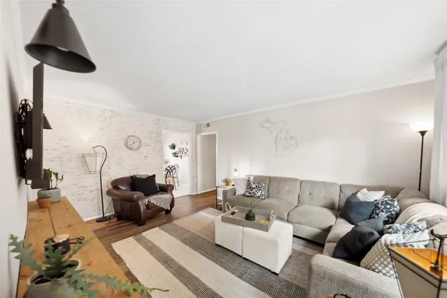 a living room with furniture and a lamp