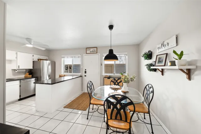 a kitchen with stainless steel appliances kitchen island granite countertop a sink and cabinets