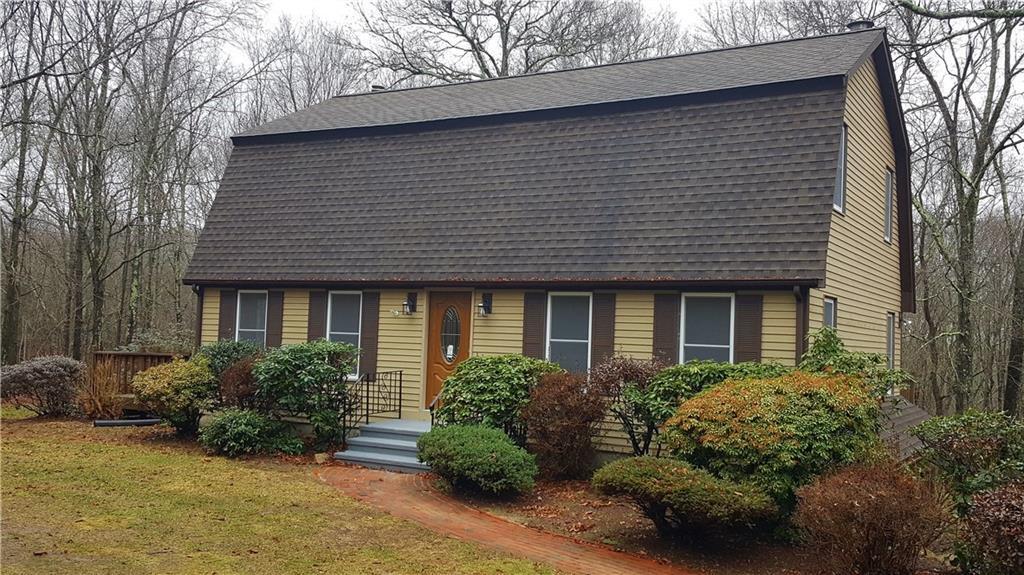 114 Lynch Road Lebanon, CT 06249 - Photo 1 of 1 a front view of a house with garden