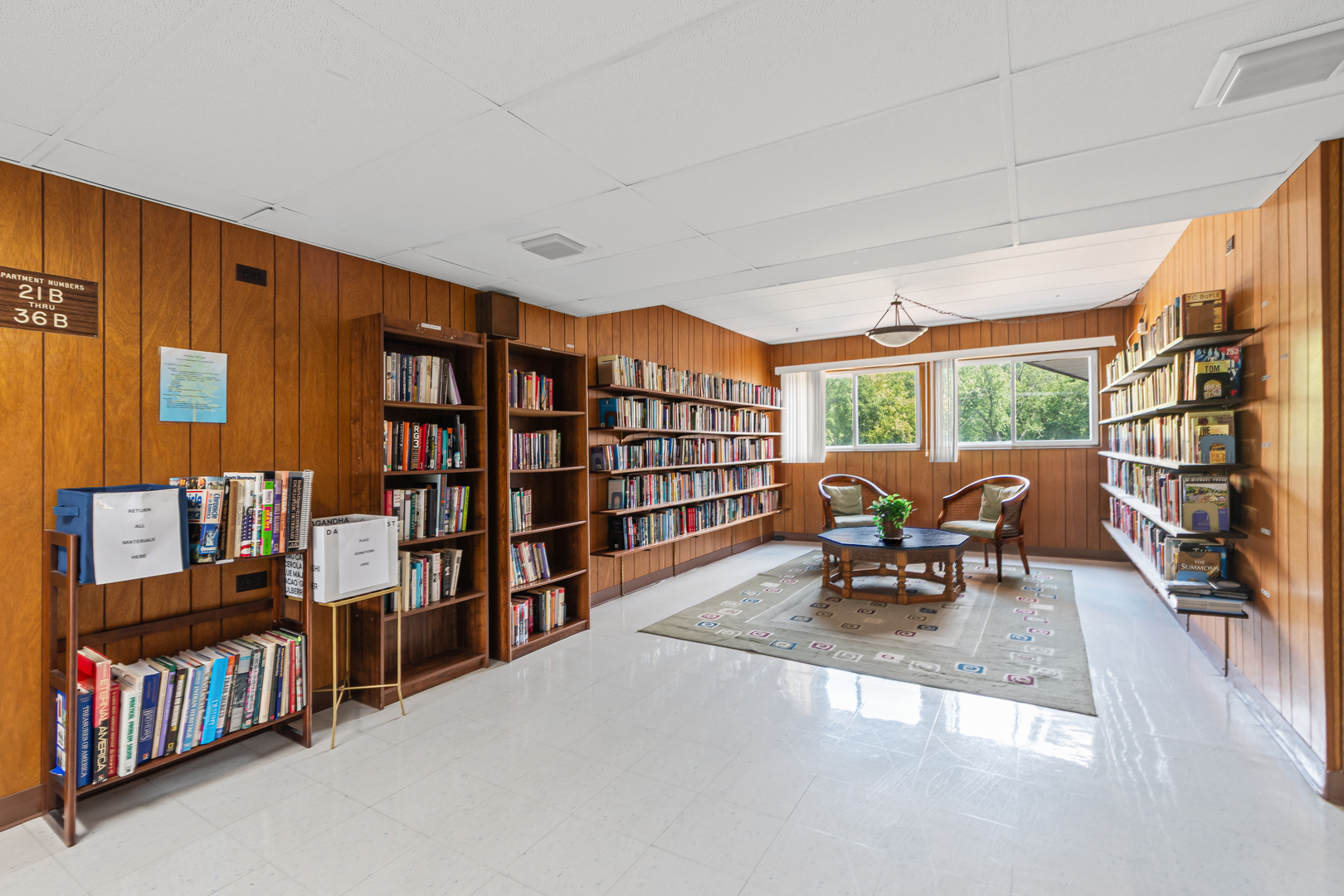 940 Holbrook Road, Unit 8B Homewood, IL 60430 - Photo 20 of 20 a reading room with furniture book shelf and a floor to ceiling window