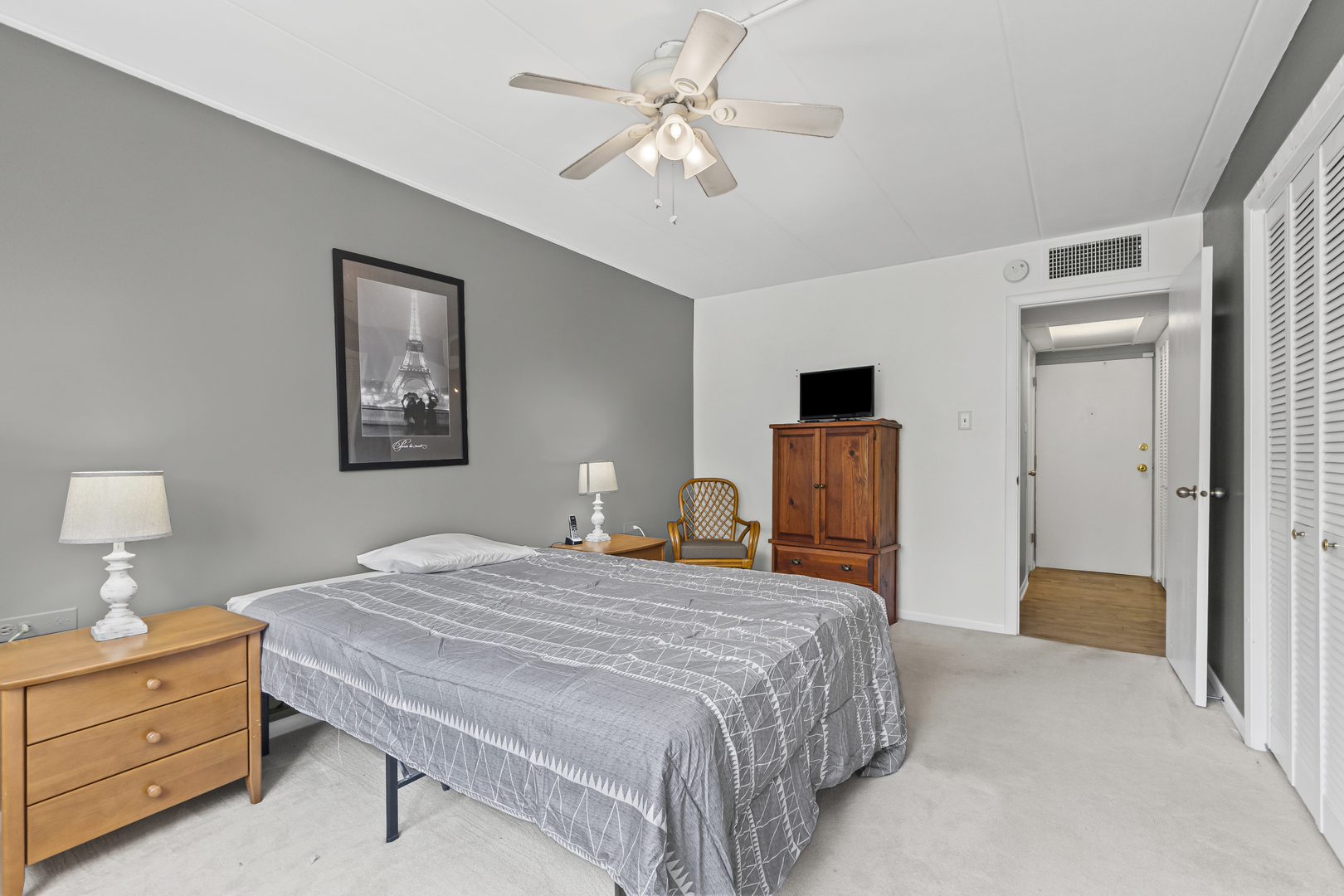 940 Holbrook Road, Unit 8B Homewood, IL 60430 - Photo 8 of 20 a bedroom with a bed and a chandelier