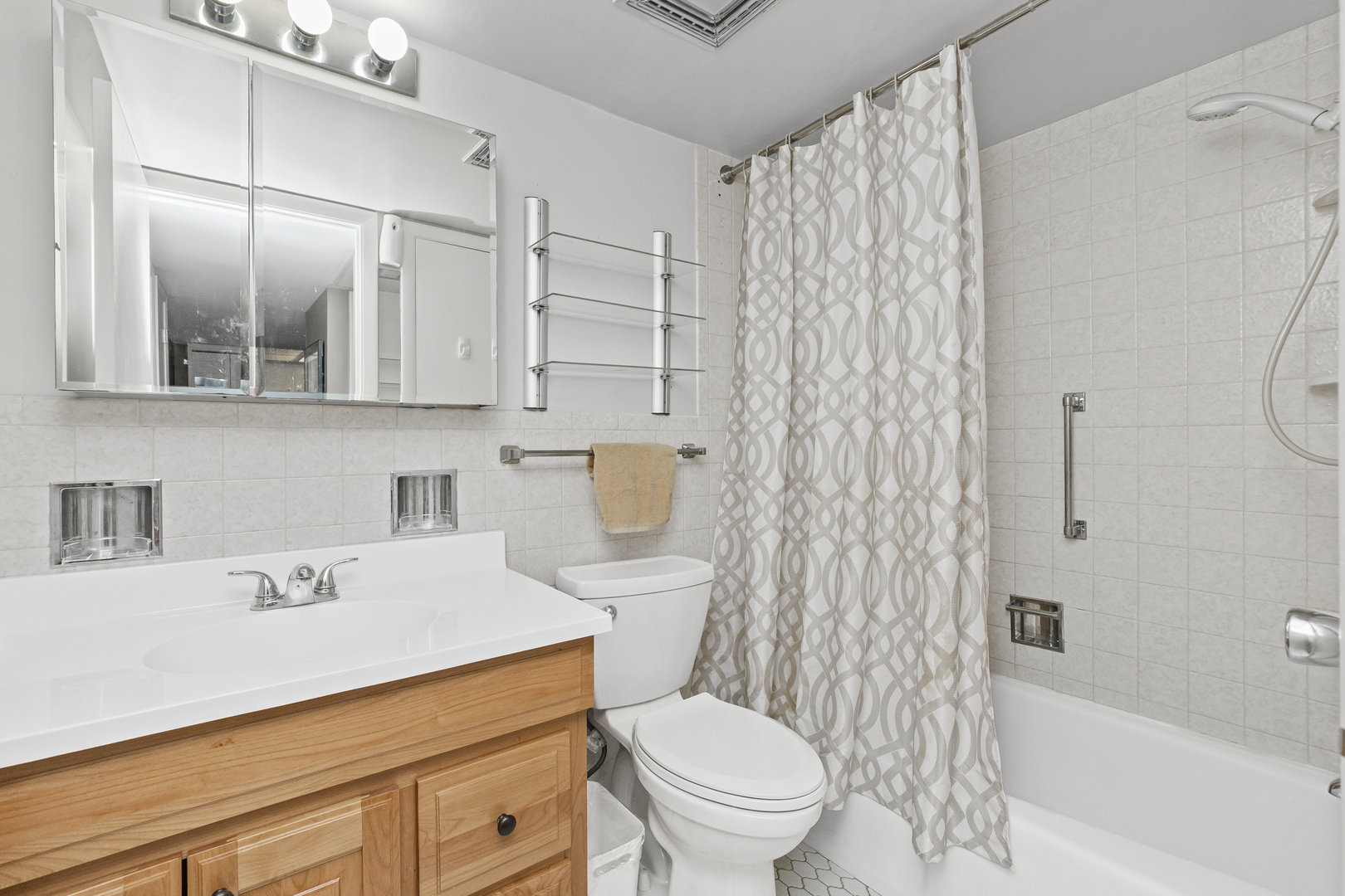 940 Holbrook Road, Unit 8B Homewood, IL 60430 - Photo 9 of 20 a bathroom with a sink toilet vanity and shower