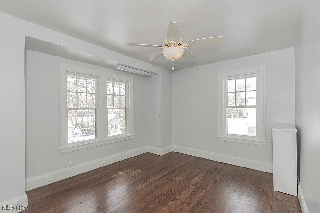 2596 Ashton Road Cleveland, OH 44118 - Photo 37 of 43 Spare room featuring a wealth of natural light, dark hardwood / wood-style flooring, and ceiling fan