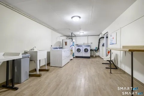 637 Cove Road, Unit A3 Stamford, CT 06902 - Photo 7 of 7 a view of a room with gym equipment and refrigerator