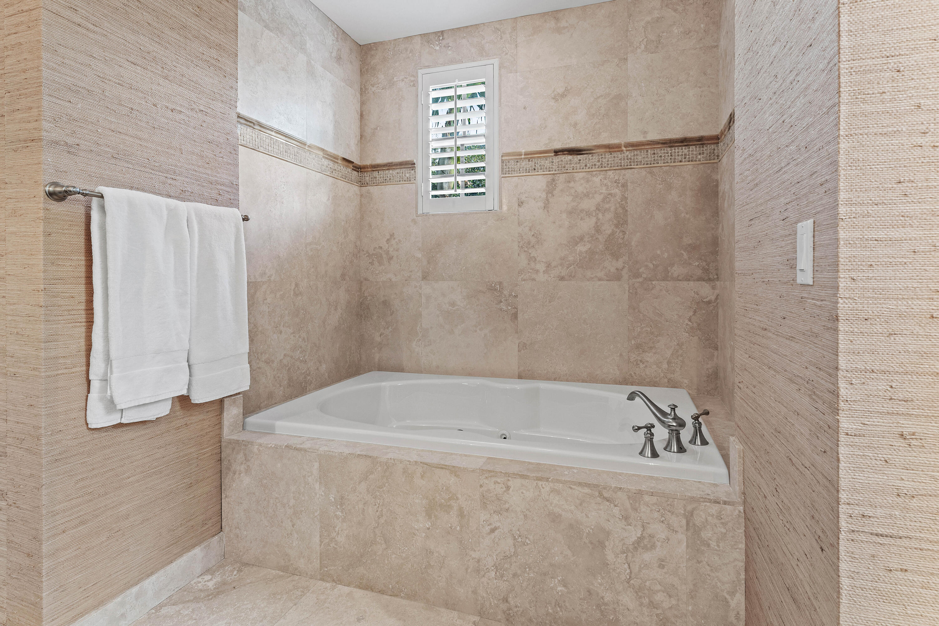 110 Gleason Street, Unit 203 Delray Beach, FL 33483 - Photo 14 of 25 a bathroom with a bathtub and a shower