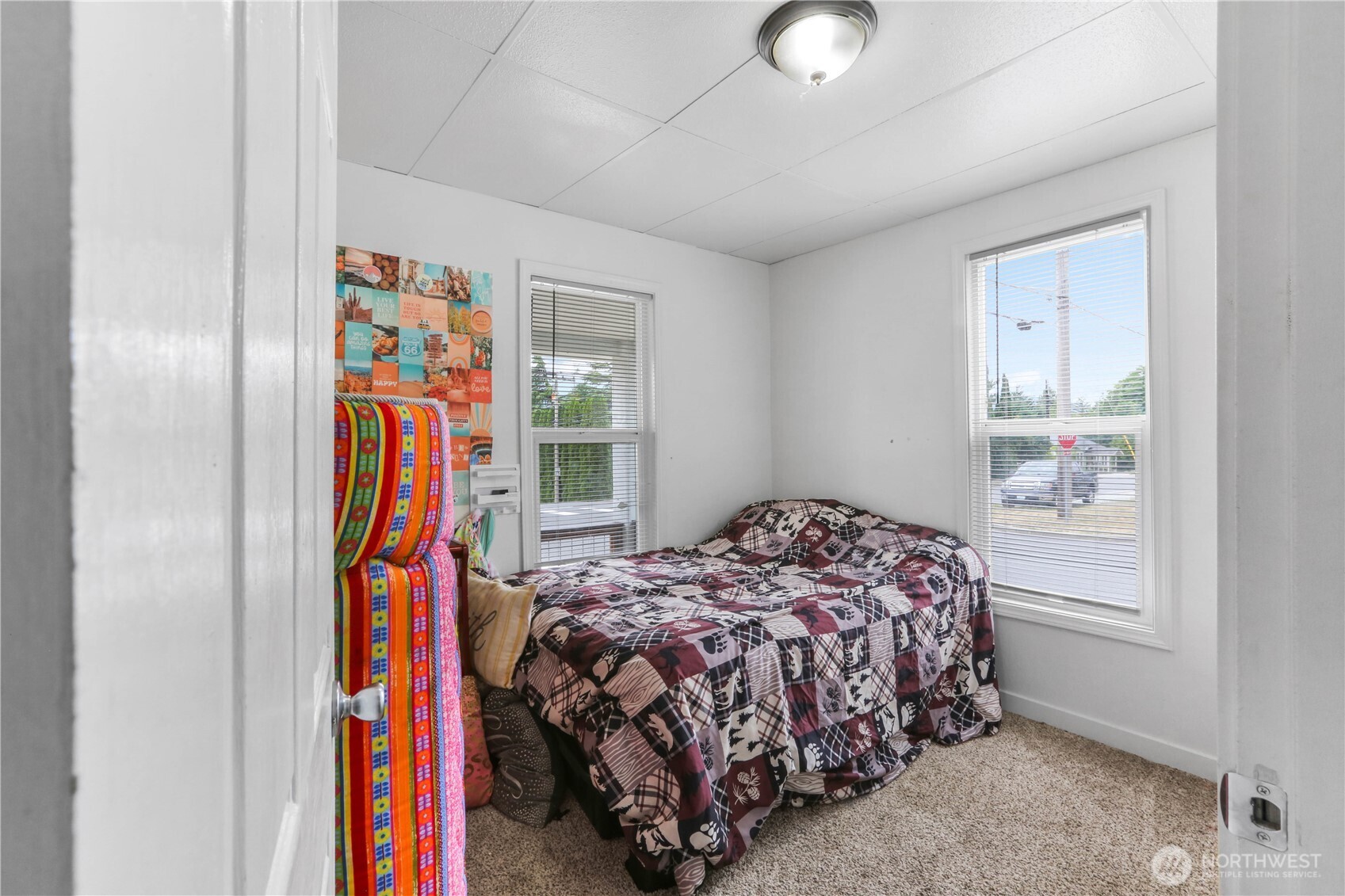 45337 Main Street Concrete, WA 98237 - Photo 13 of 40 a bedroom with a bed and a window