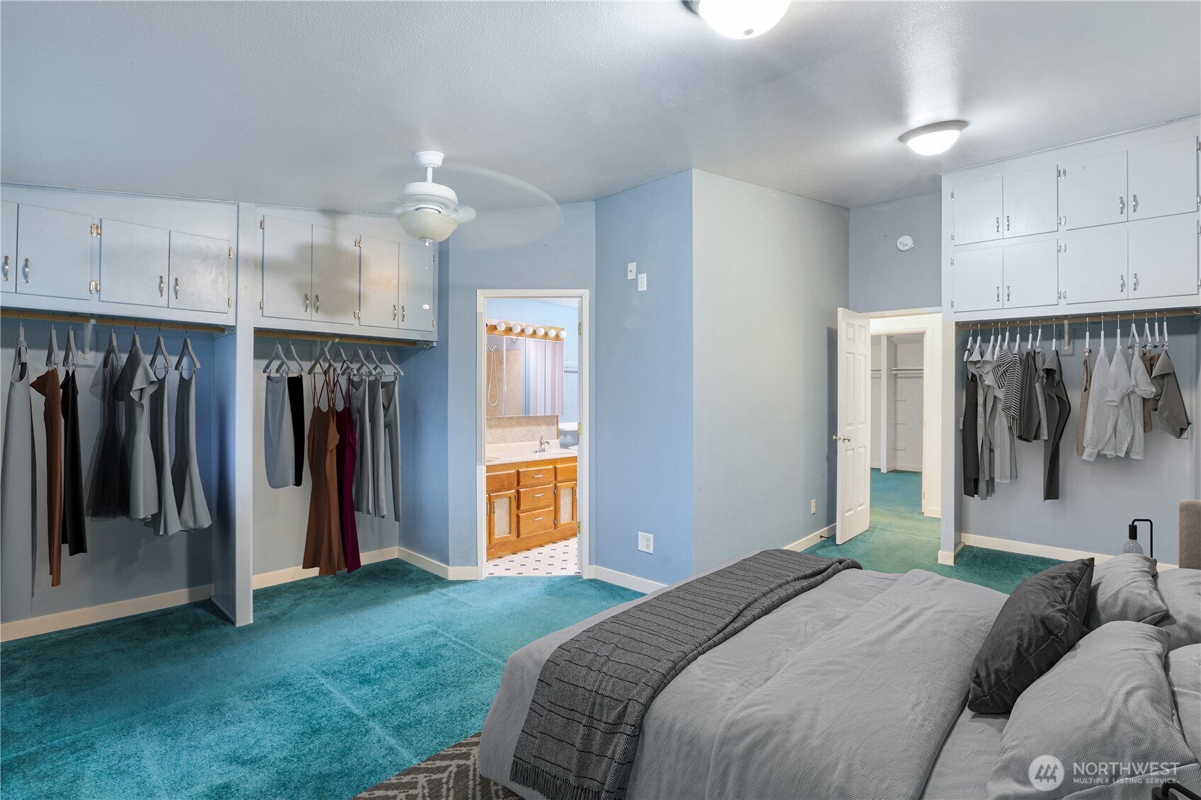 45337 Main Street Concrete, WA 98237 - Photo 33 of 40 a bedroom with a bed and a walk in closet