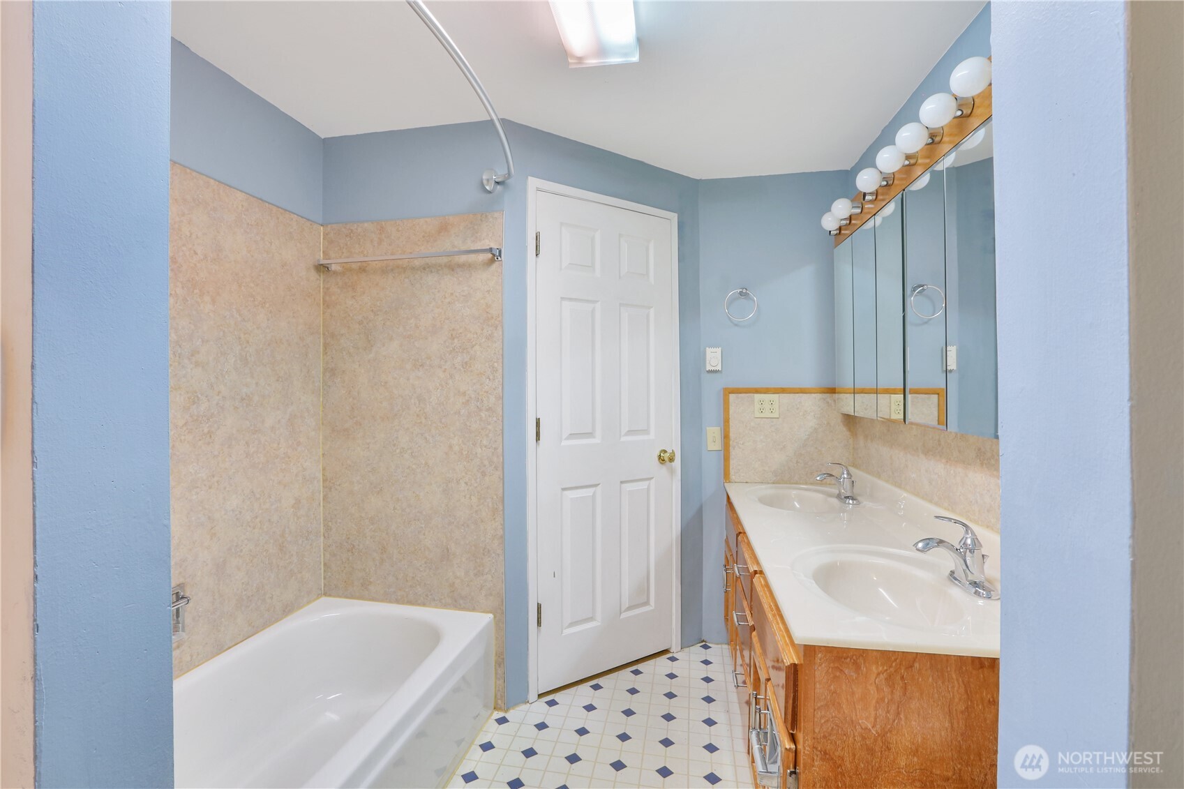 45337 Main Street Concrete, WA 98237 - Photo 35 of 40 a bathroom with a sink a mirror and a bathtub