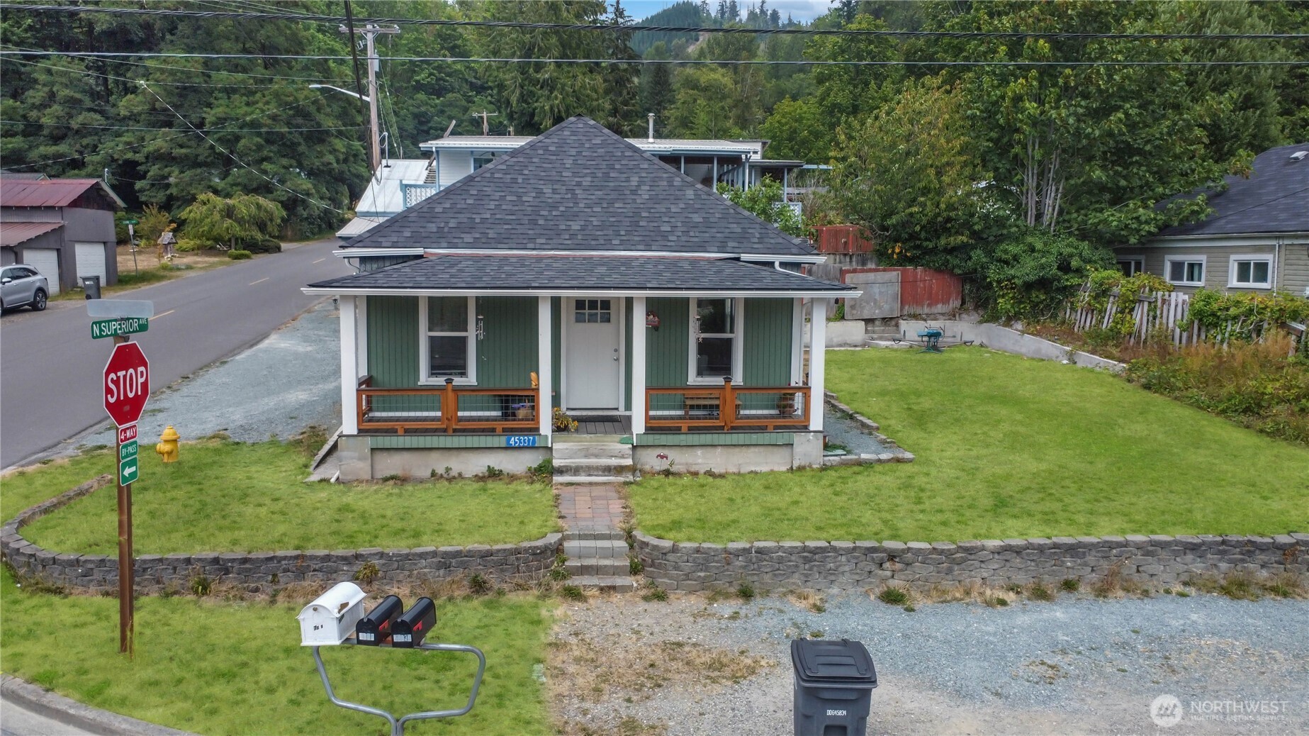 45337 Main Street Concrete, WA 98237 - Photo 4 of 40 a front view of a house with a yard