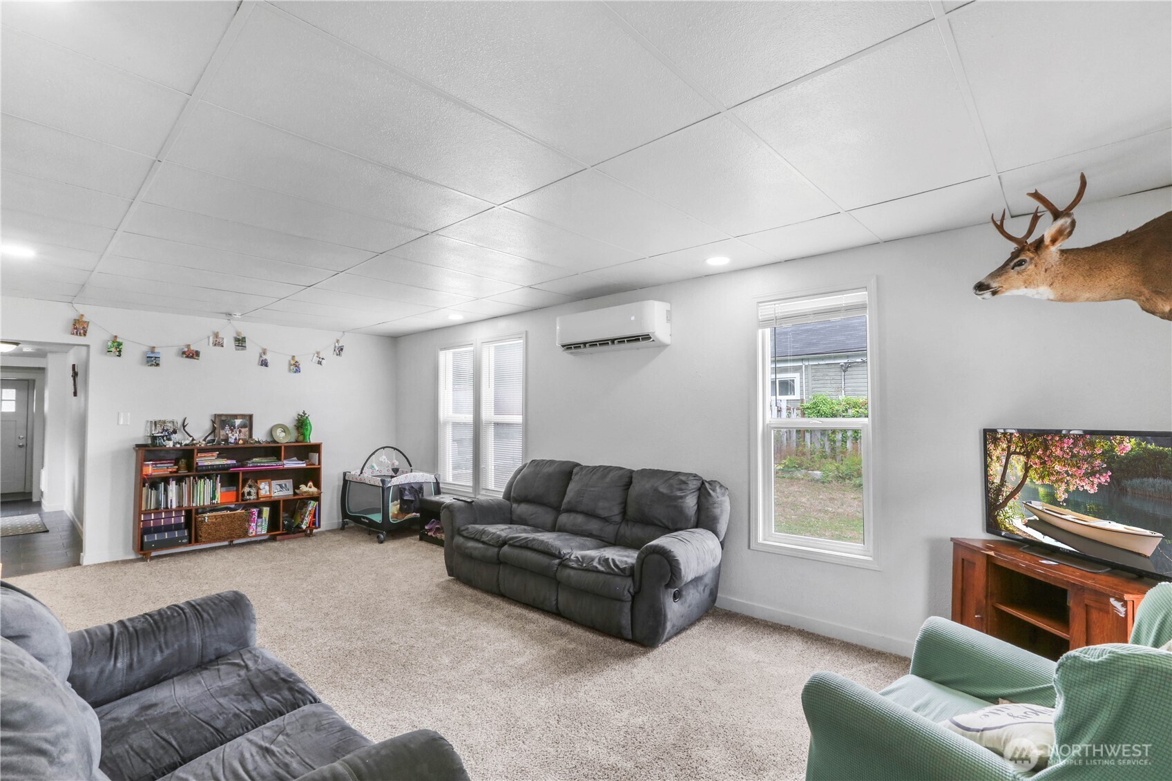 45337 Main Street Concrete, WA 98237 - Photo 7 of 40 a living room with furniture and a window