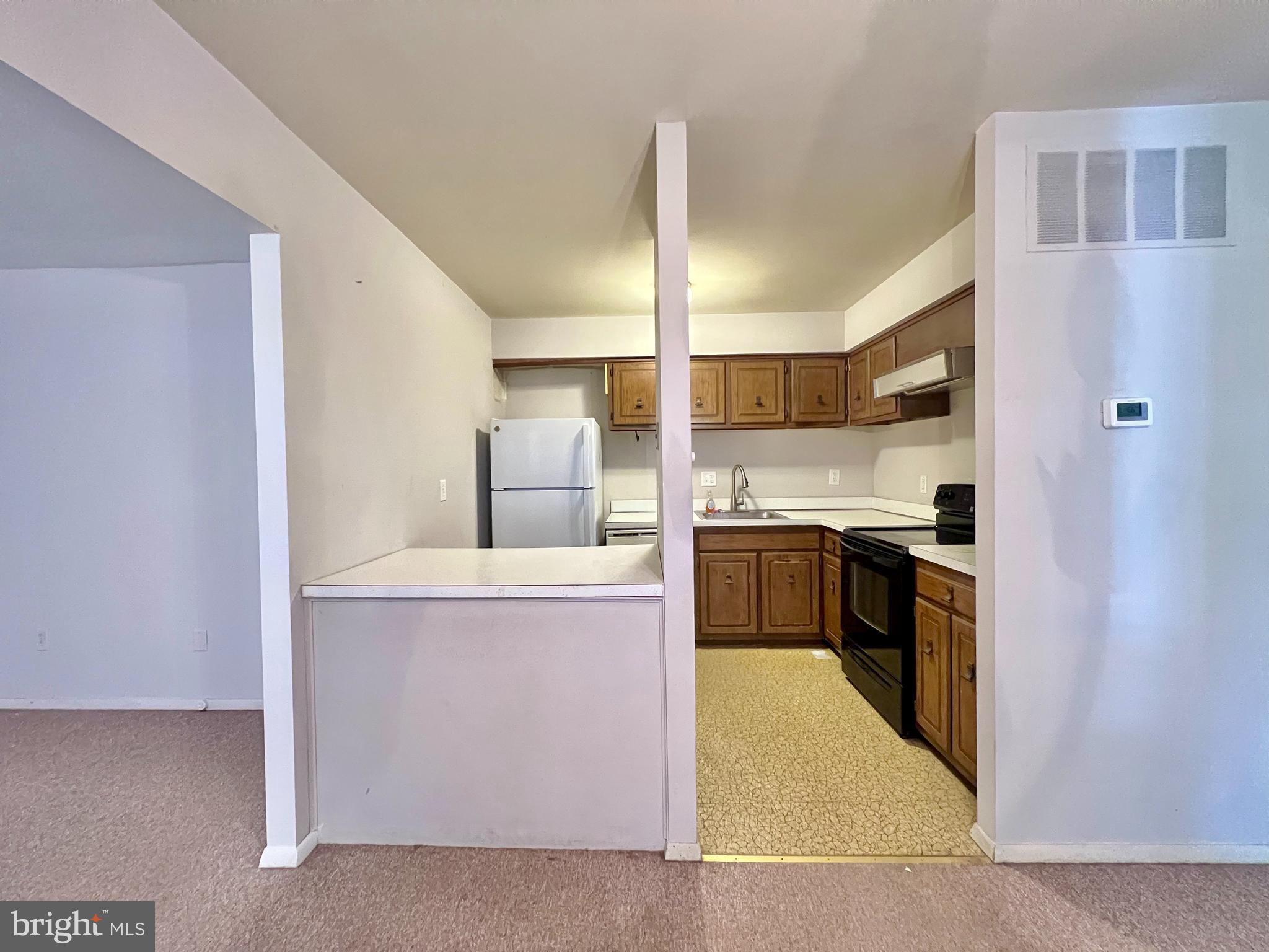 22 Fitzwatertown Road, Unit D8 Willow Grove, PA 19090 - Photo 9 of 34 View from dining room into kitchen