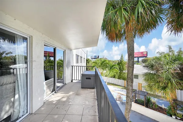 a balcony with wooden floor