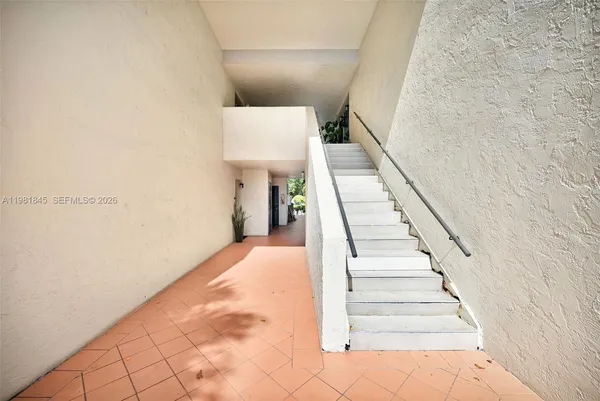 a view of a hallway with staircase