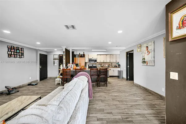 a bed room with furniture and a flat screen tv