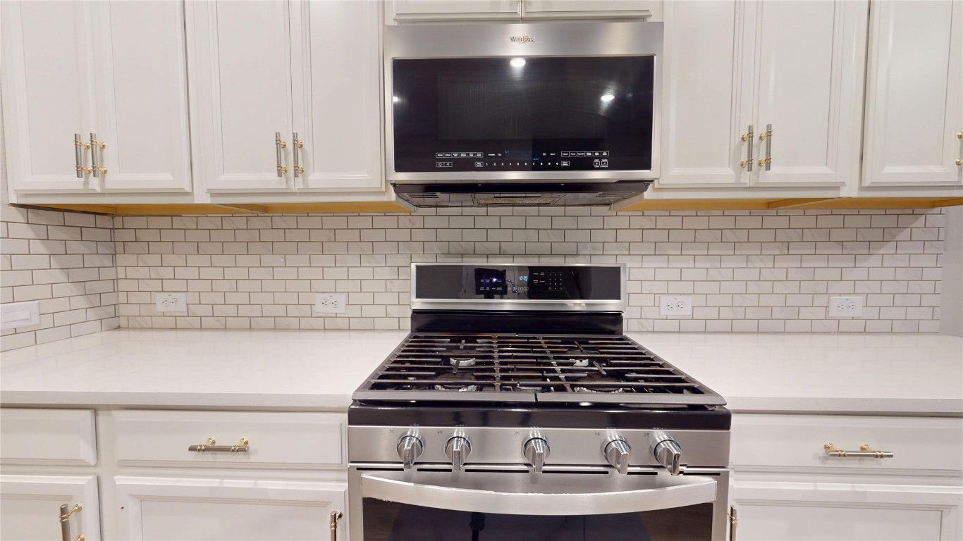 21606 Reserve Ranch Trail Richmond, TX 77407 - Photo 15 of 48 a stove top oven sitting inside of a kitchen