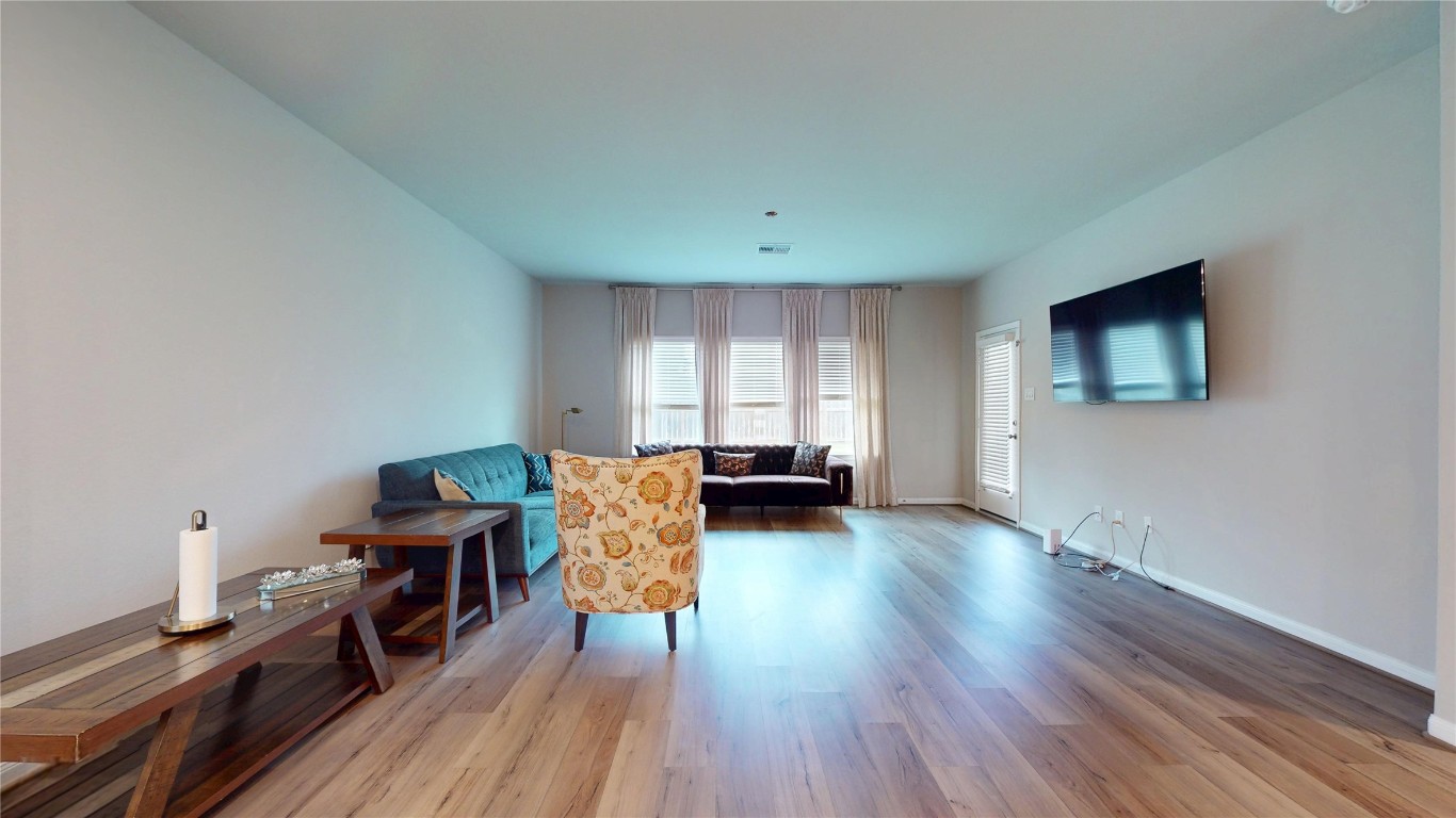 21606 Reserve Ranch Trail Richmond, TX 77407 - Photo 19 of 48 a living room with furniture and a flat screen tv