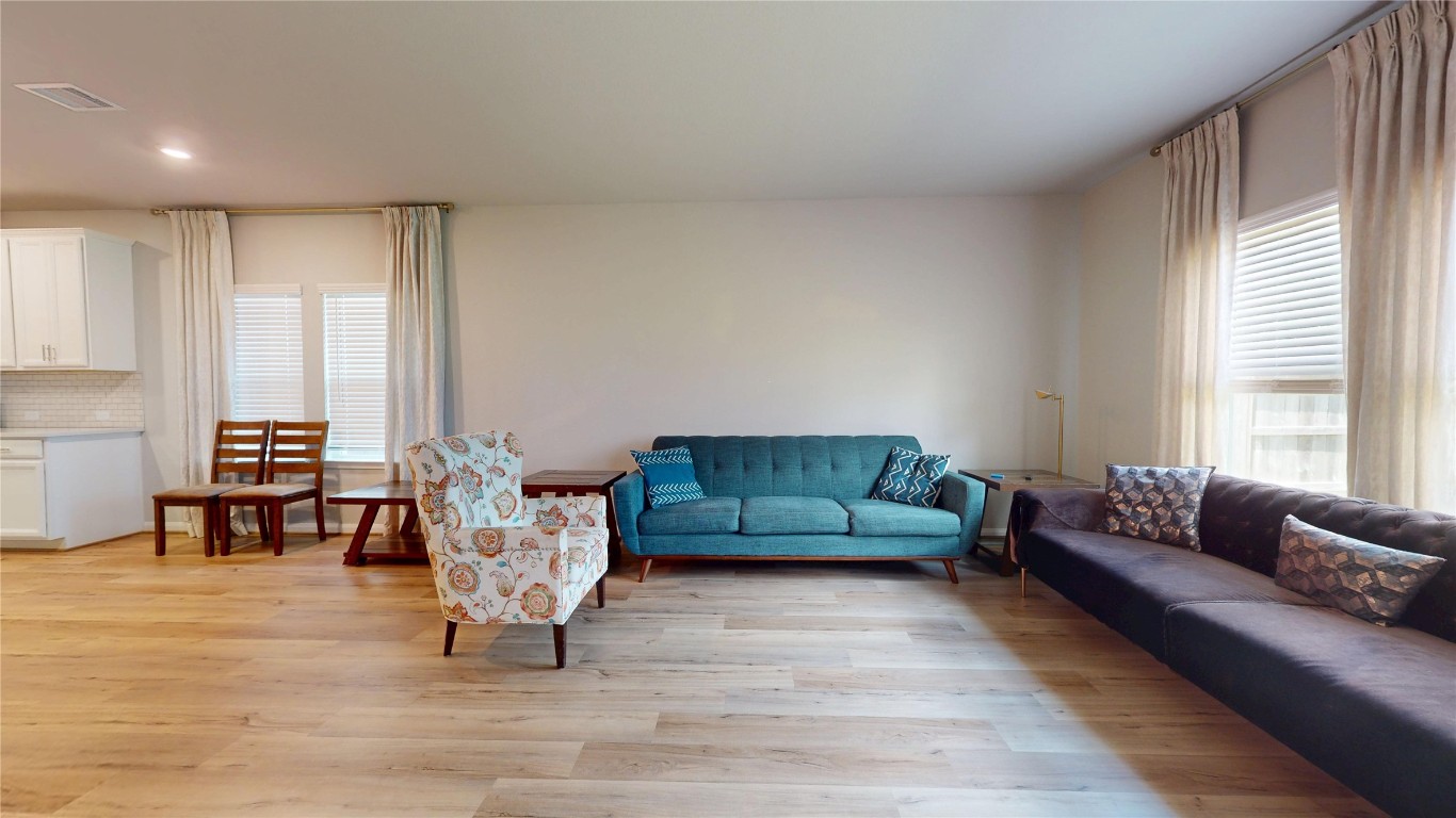 21606 Reserve Ranch Trail Richmond, TX 77407 - Photo 23 of 48 a living room with furniture and a large window