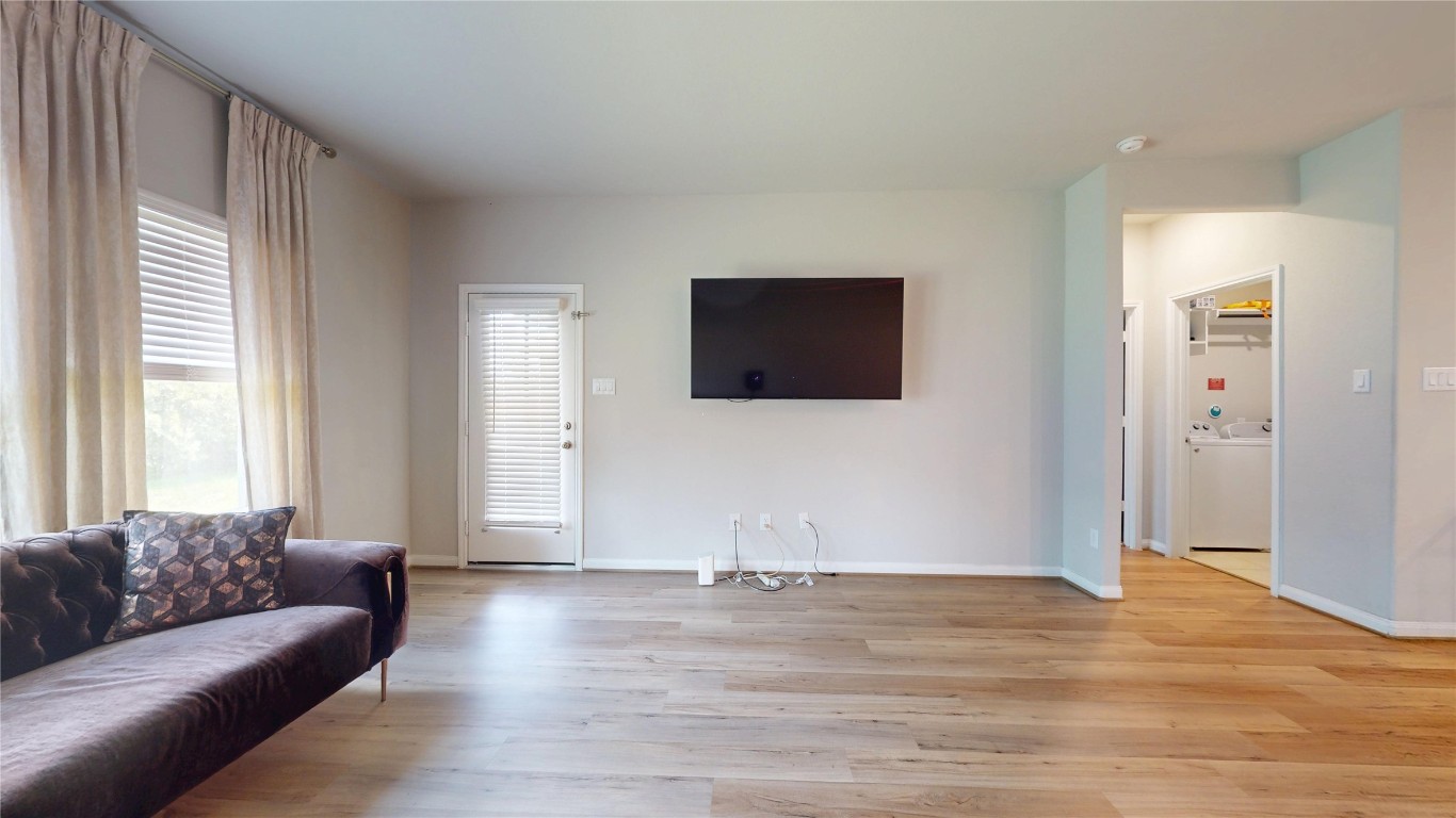 21606 Reserve Ranch Trail Richmond, TX 77407 - Photo 24 of 48 a living room with couches and a flat screen tv