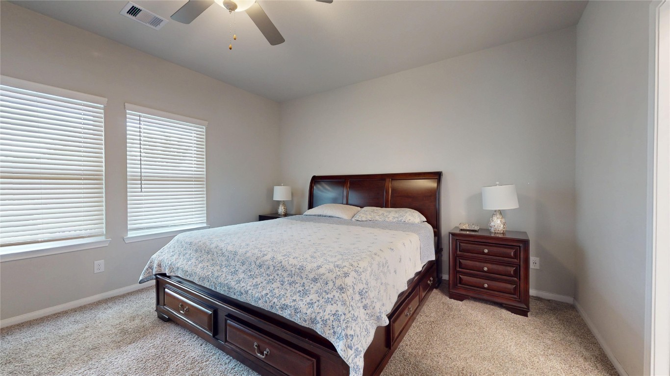 21606 Reserve Ranch Trail Richmond, TX 77407 - Photo 26 of 48 a bedroom with a bed and a night stand