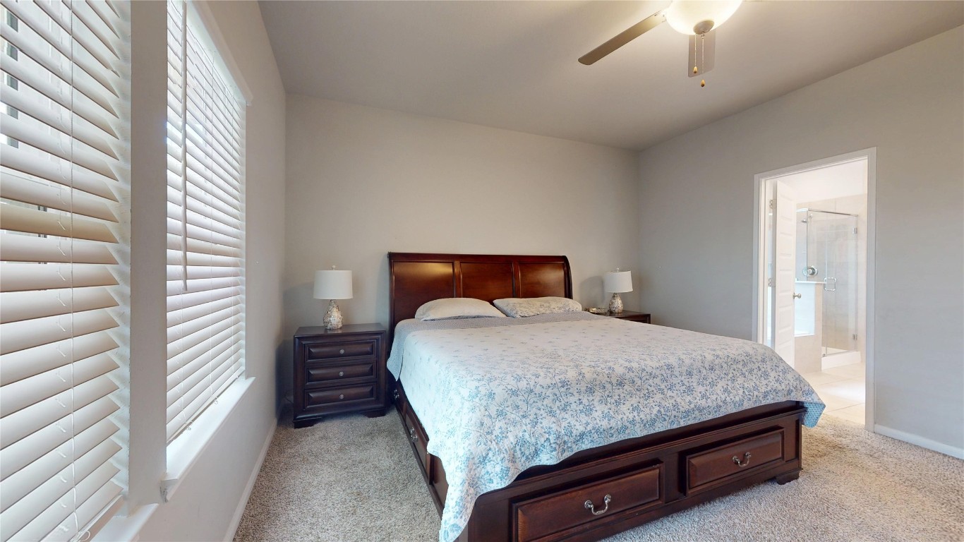 21606 Reserve Ranch Trail Richmond, TX 77407 - Photo 27 of 48 a bedroom with a bed and a large window