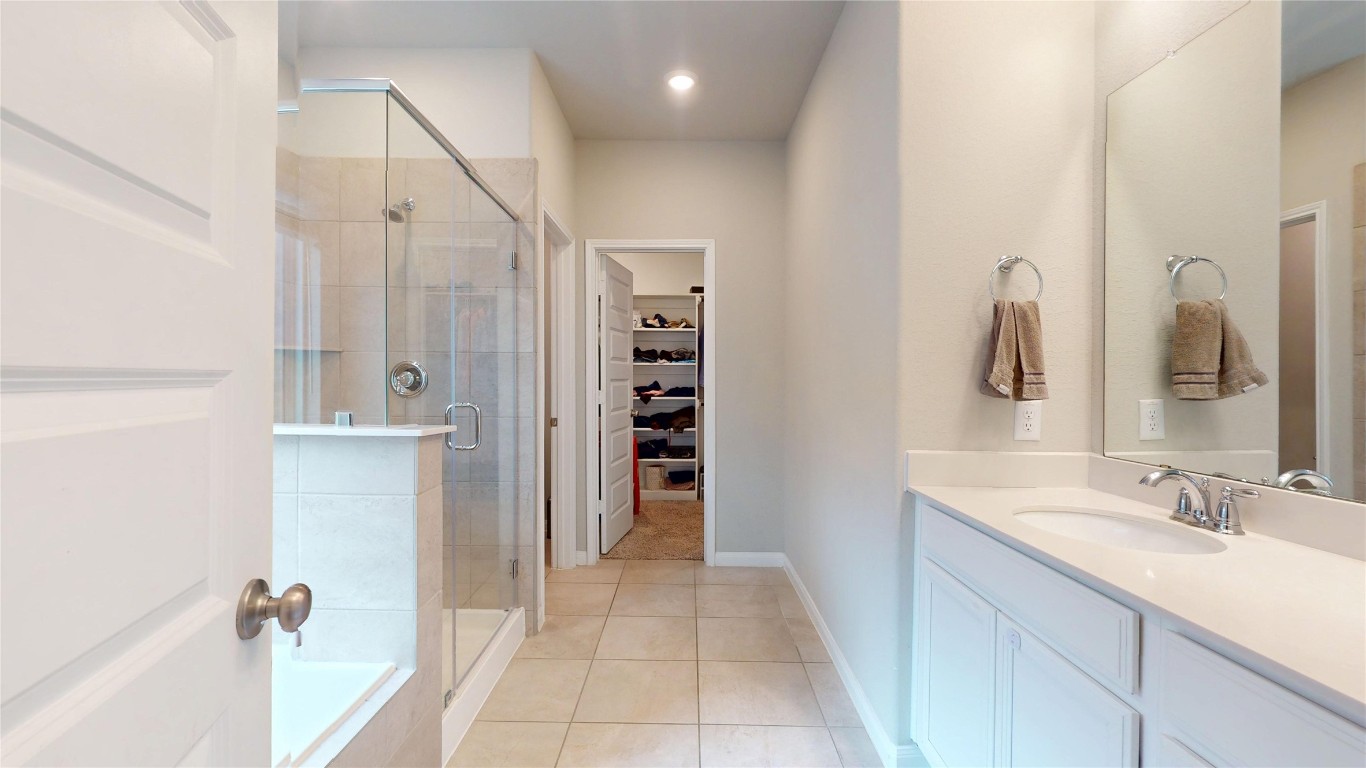 21606 Reserve Ranch Trail Richmond, TX 77407 - Photo 29 of 48 a bathroom with a double vanity sink and a mirror