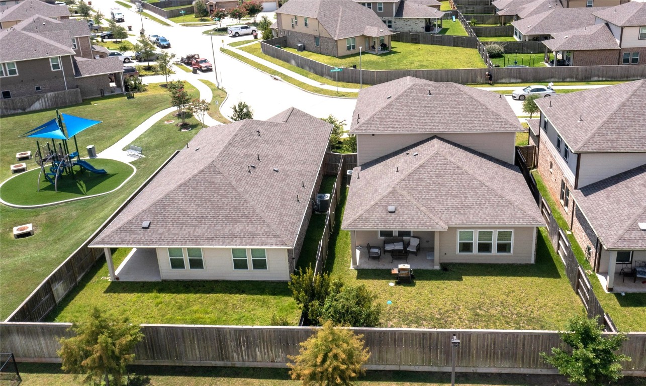 21606 Reserve Ranch Trail Richmond, TX 77407 - Photo 3 of 48 an aerial view of a house with a garden and yard