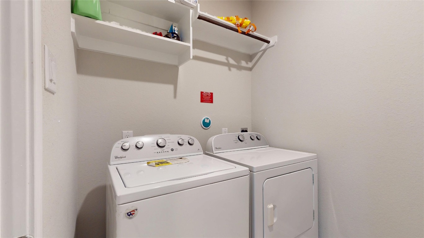 21606 Reserve Ranch Trail Richmond, TX 77407 - Photo 33 of 48 a utility room with dryer and washer