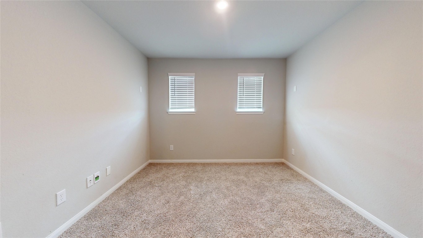 21606 Reserve Ranch Trail Richmond, TX 77407 - Photo 39 of 48 an empty room with a window