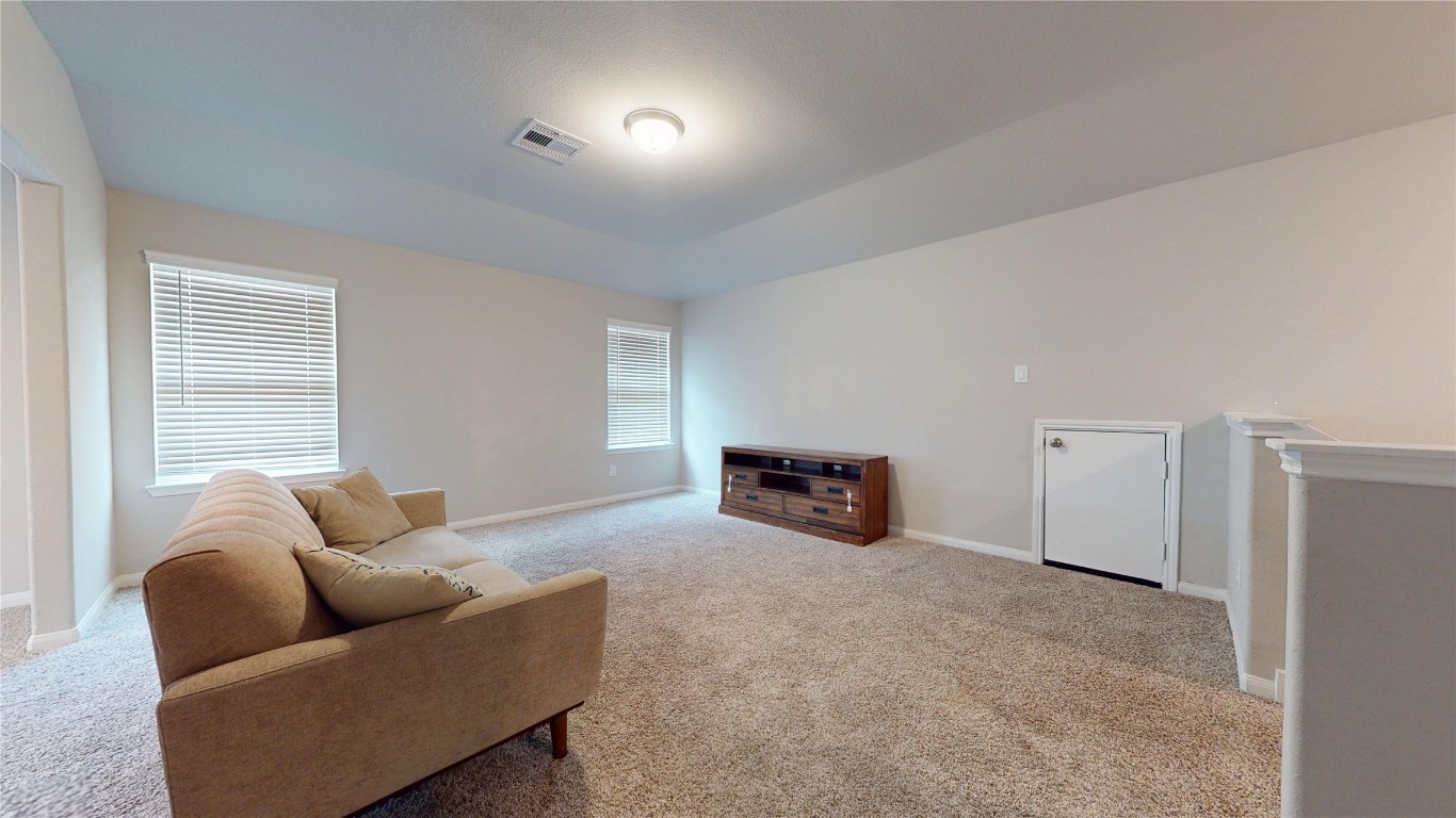 21606 Reserve Ranch Trail Richmond, TX 77407 - Photo 40 of 48 a living room with furniture and a window