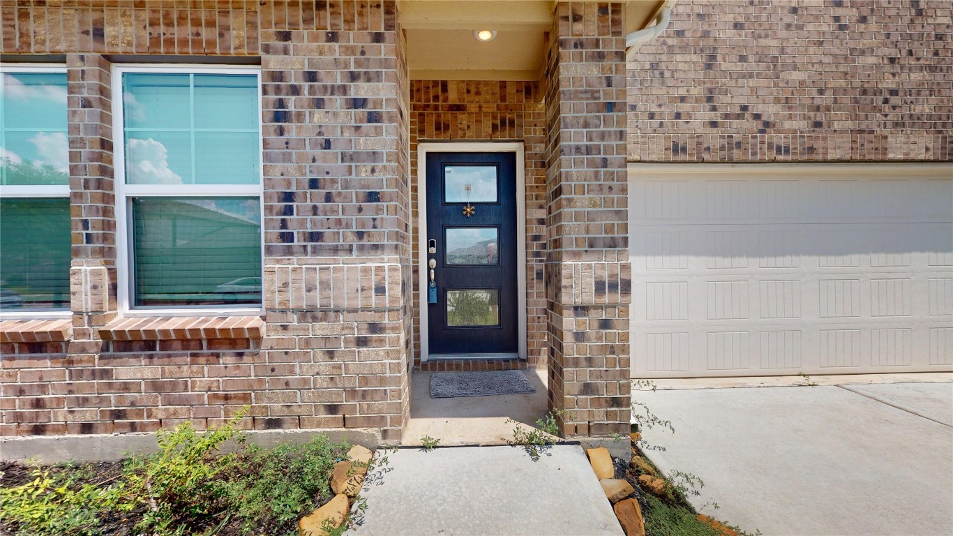 21606 Reserve Ranch Trail Richmond, TX 77407 - Photo 4 of 48 a front view of a house with a yard