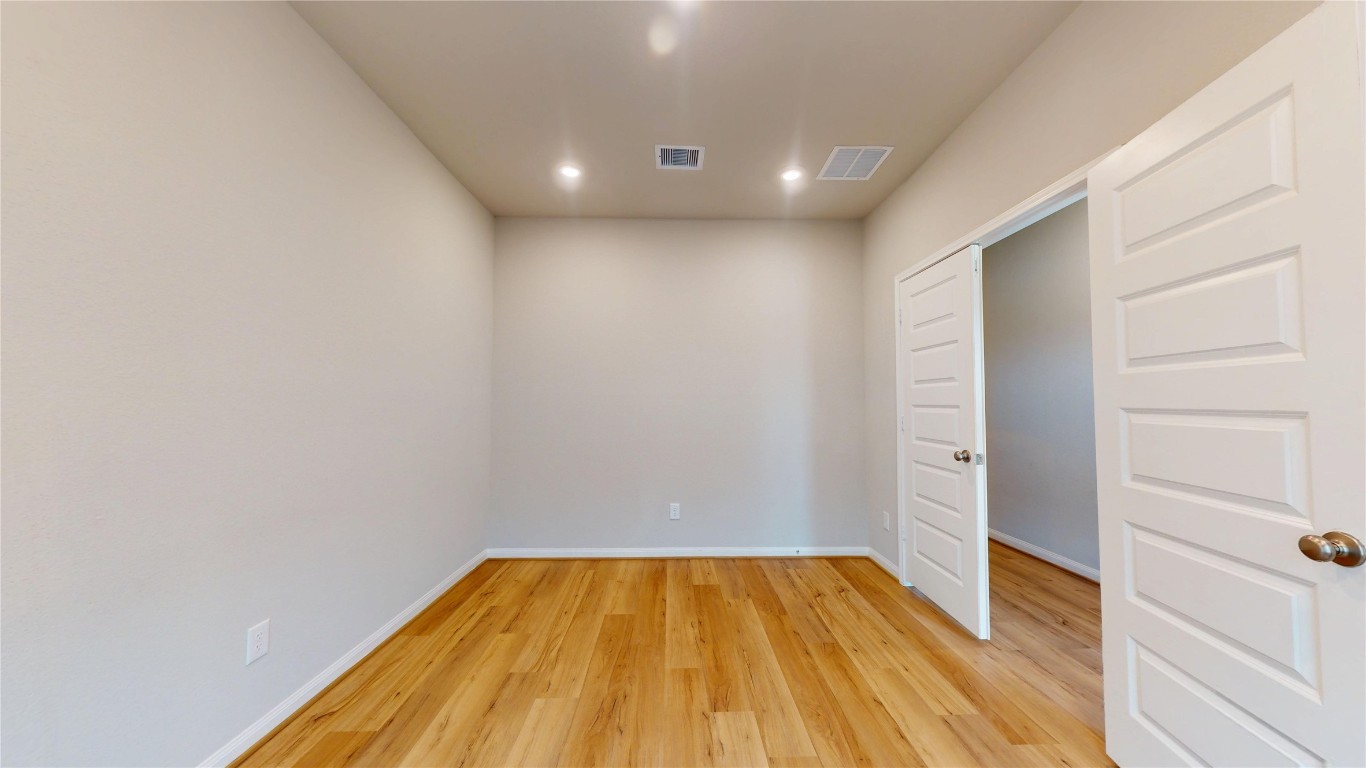 21606 Reserve Ranch Trail Richmond, TX 77407 - Photo 9 of 48 a view of empty room with wooden floor