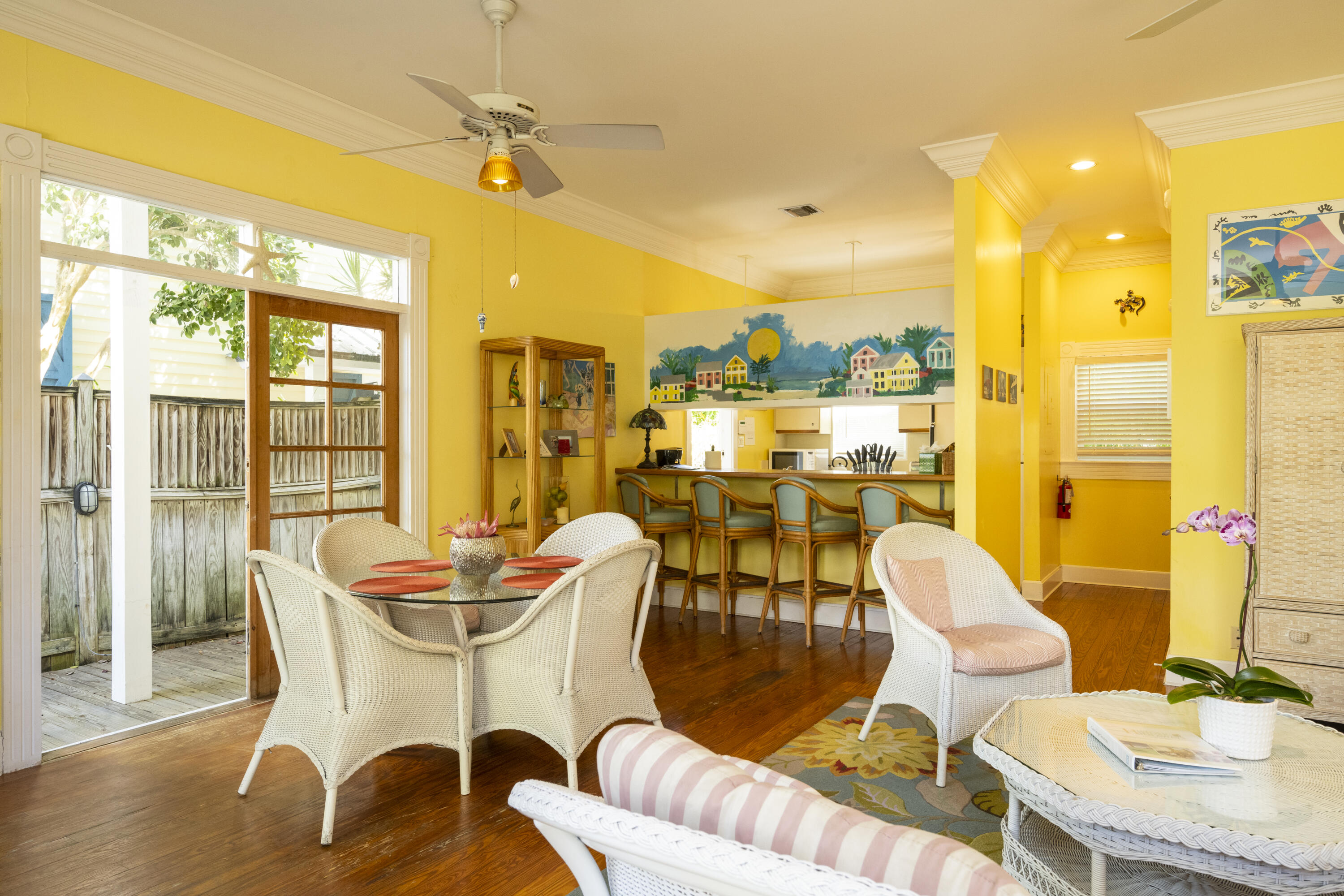 1003 United Street, Unit B Key West, FL 33040 - Photo 13 of 39 a dining room with furniture a chandelier and wooden floor