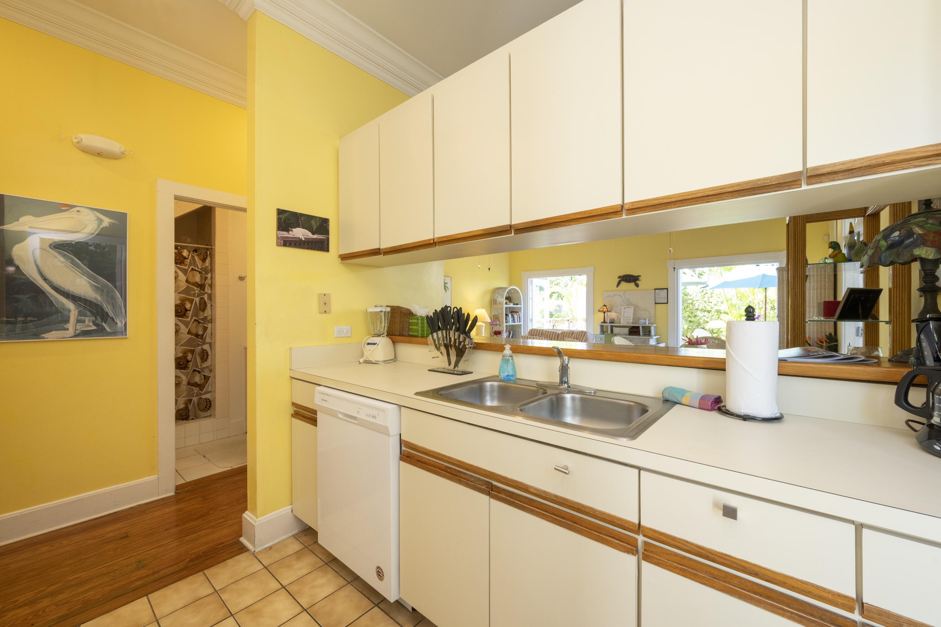 1003 United Street, Unit B Key West, FL 33040 - Photo 17 of 39 a kitchen with stainless steel appliances granite countertop a sink and cabinets