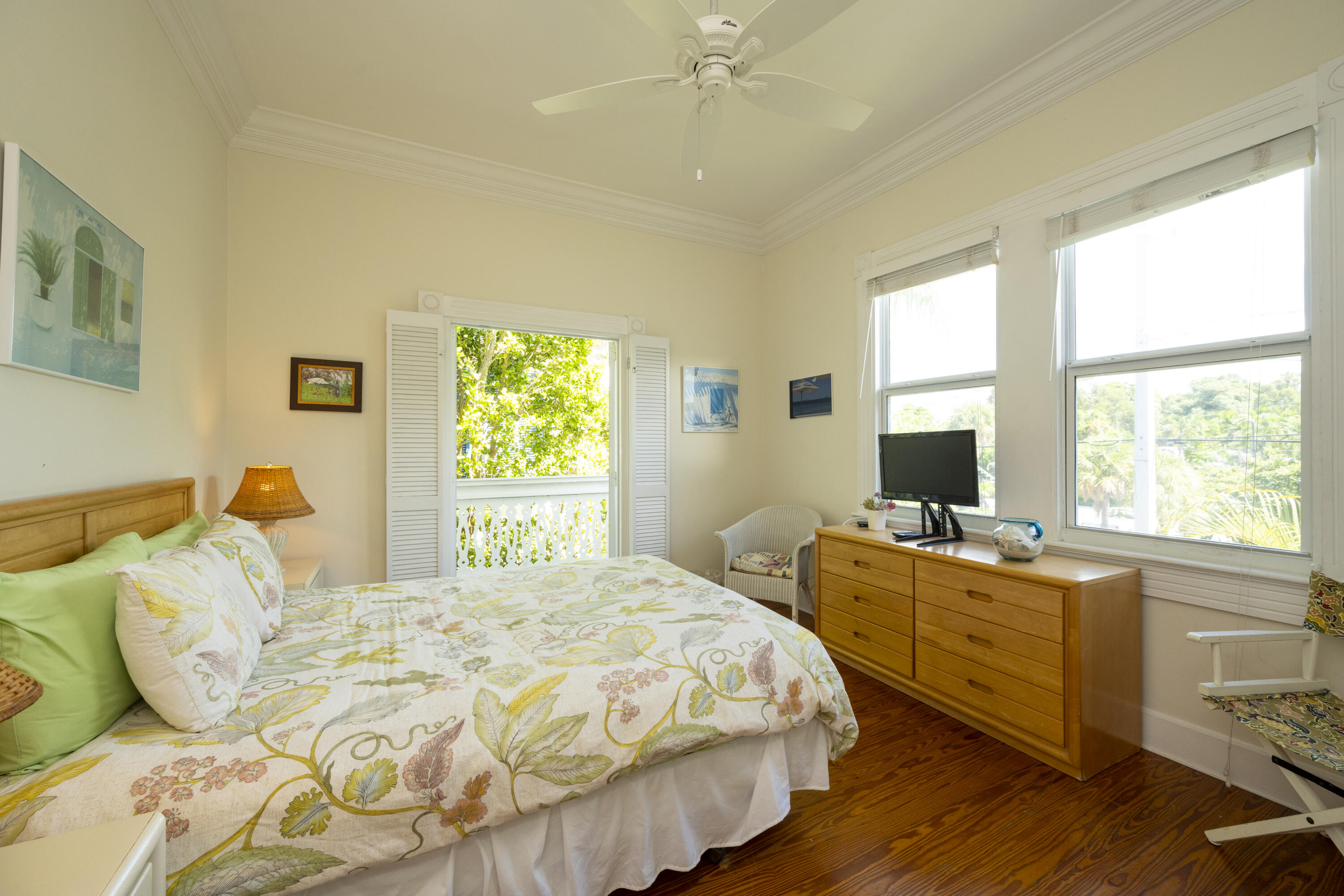 1003 United Street, Unit B Key West, FL 33040 - Photo 21 of 39 a bedroom with a bed and a large window