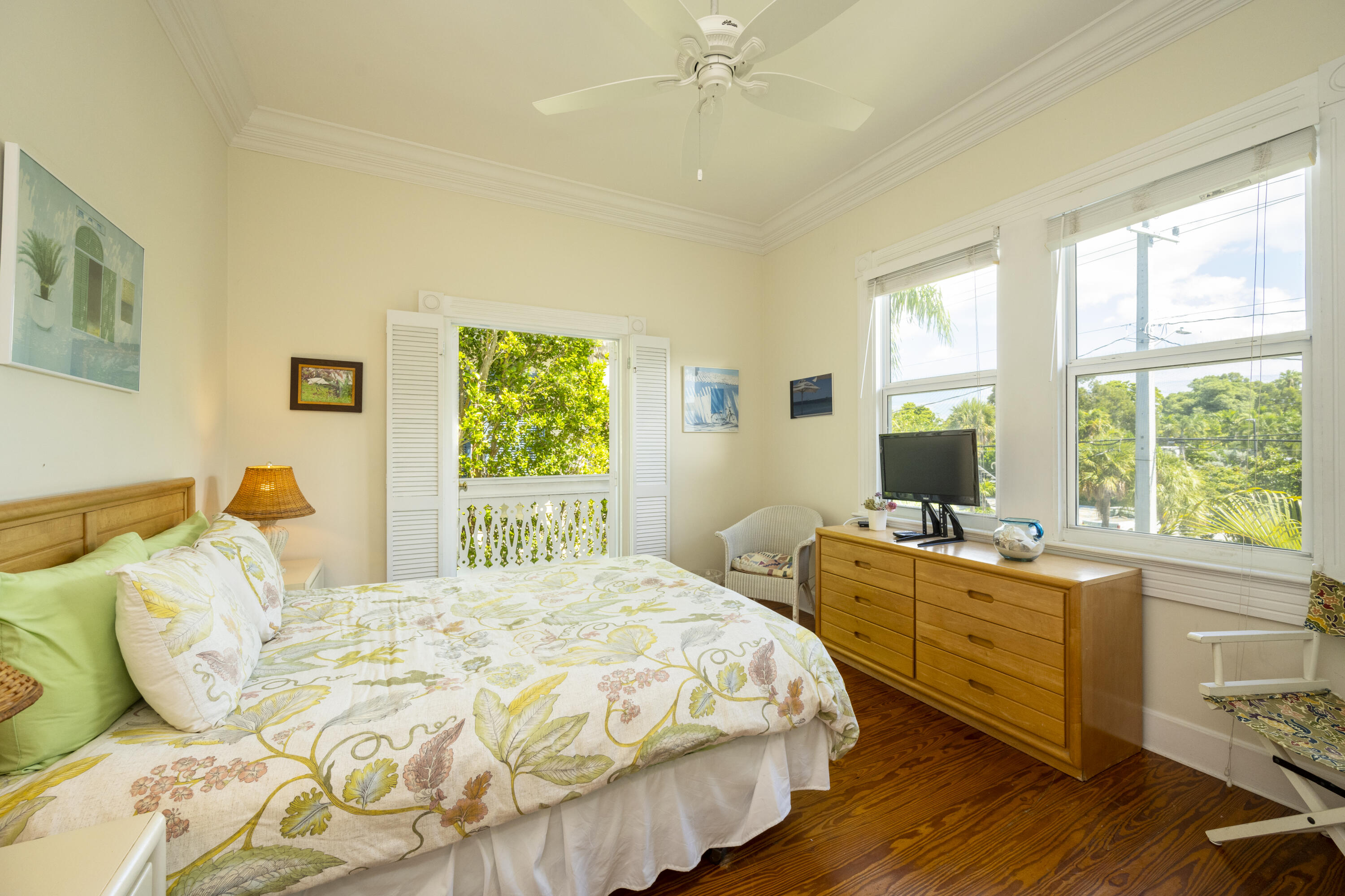 1003 United Street, Unit B Key West, FL 33040 - Photo 22 of 39 a bedroom with a bed and a large window