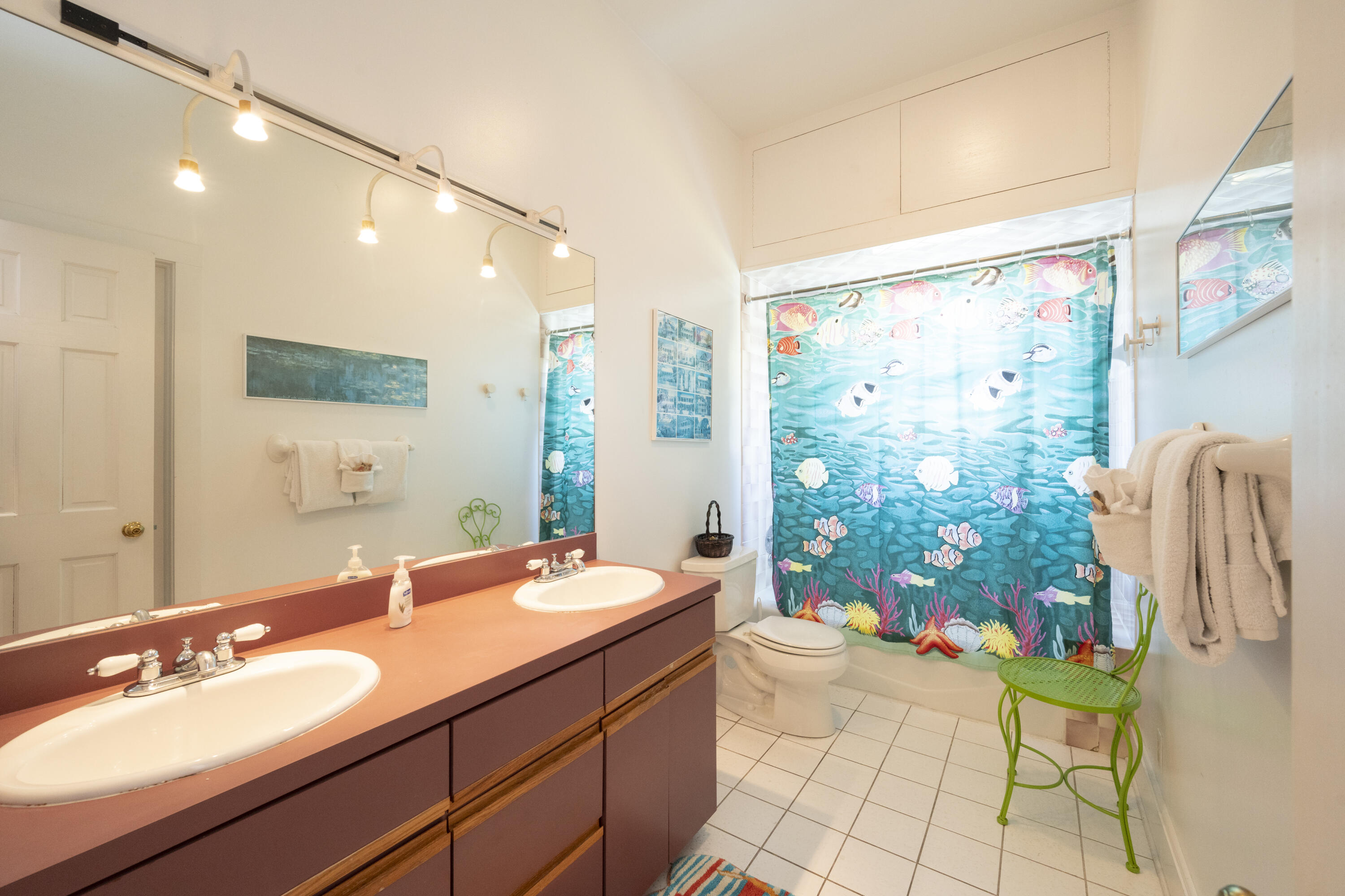 1003 United Street, Unit B Key West, FL 33040 - Photo 26 of 39 a bathroom with a double vanity sink toilet and shower