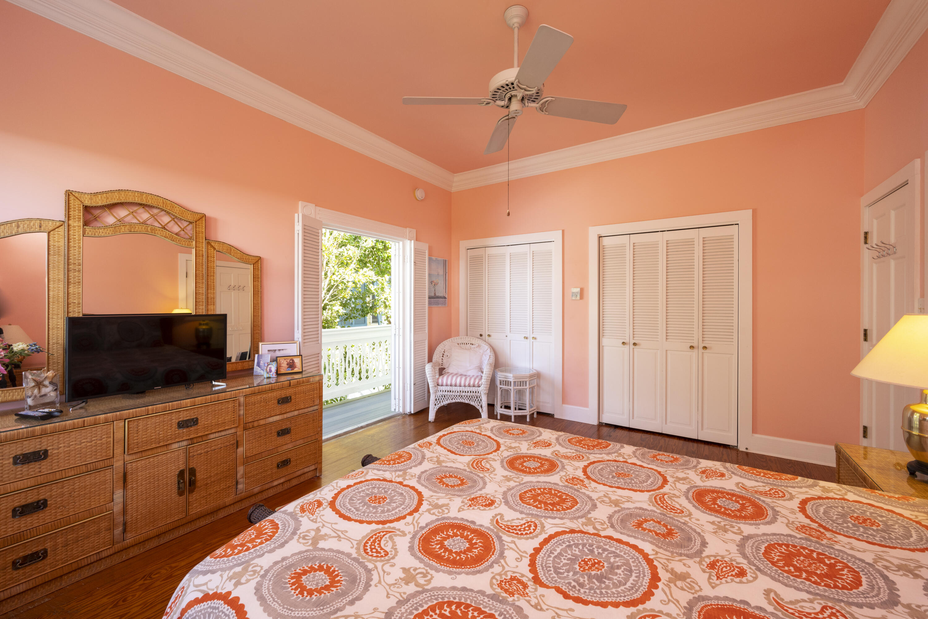 1003 United Street, Unit B Key West, FL 33040 - Photo 29 of 39 a bedroom with a bed and wooden floor