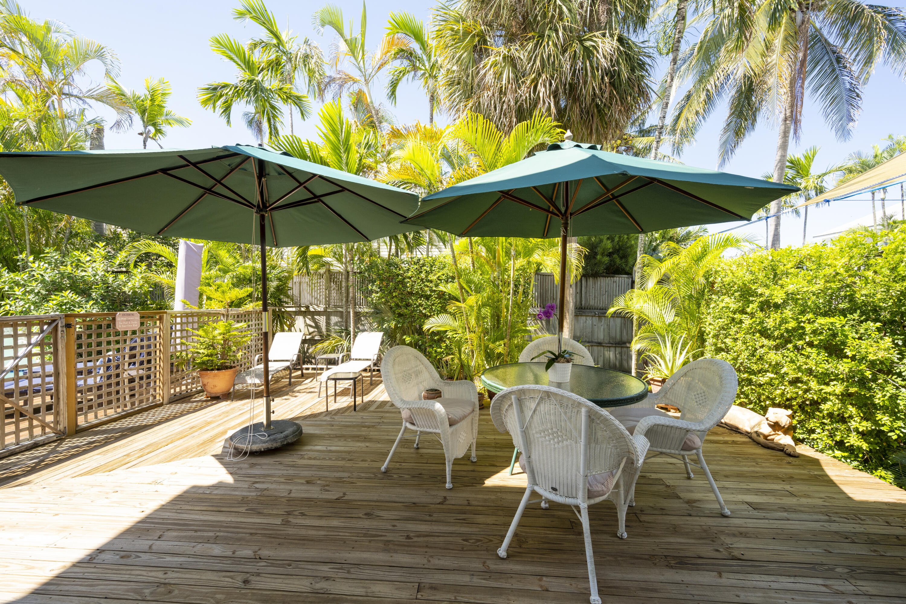 1003 United Street, Unit B Key West, FL 33040 - Photo 33 of 39 a view of a chairs and table in the patio