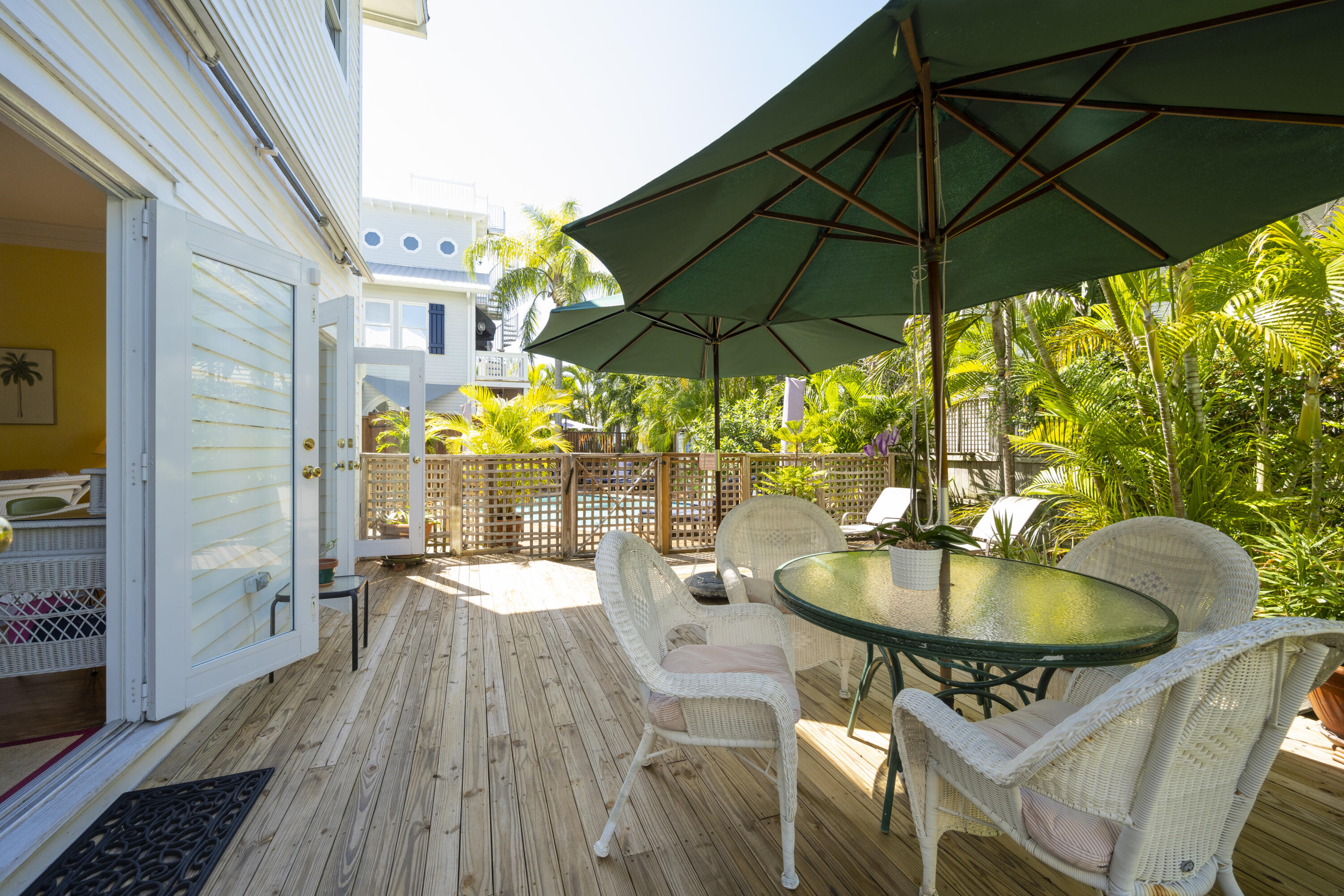 1003 United Street, Unit B Key West, FL 33040 - Photo 34 of 39 a table and chairs in the patio