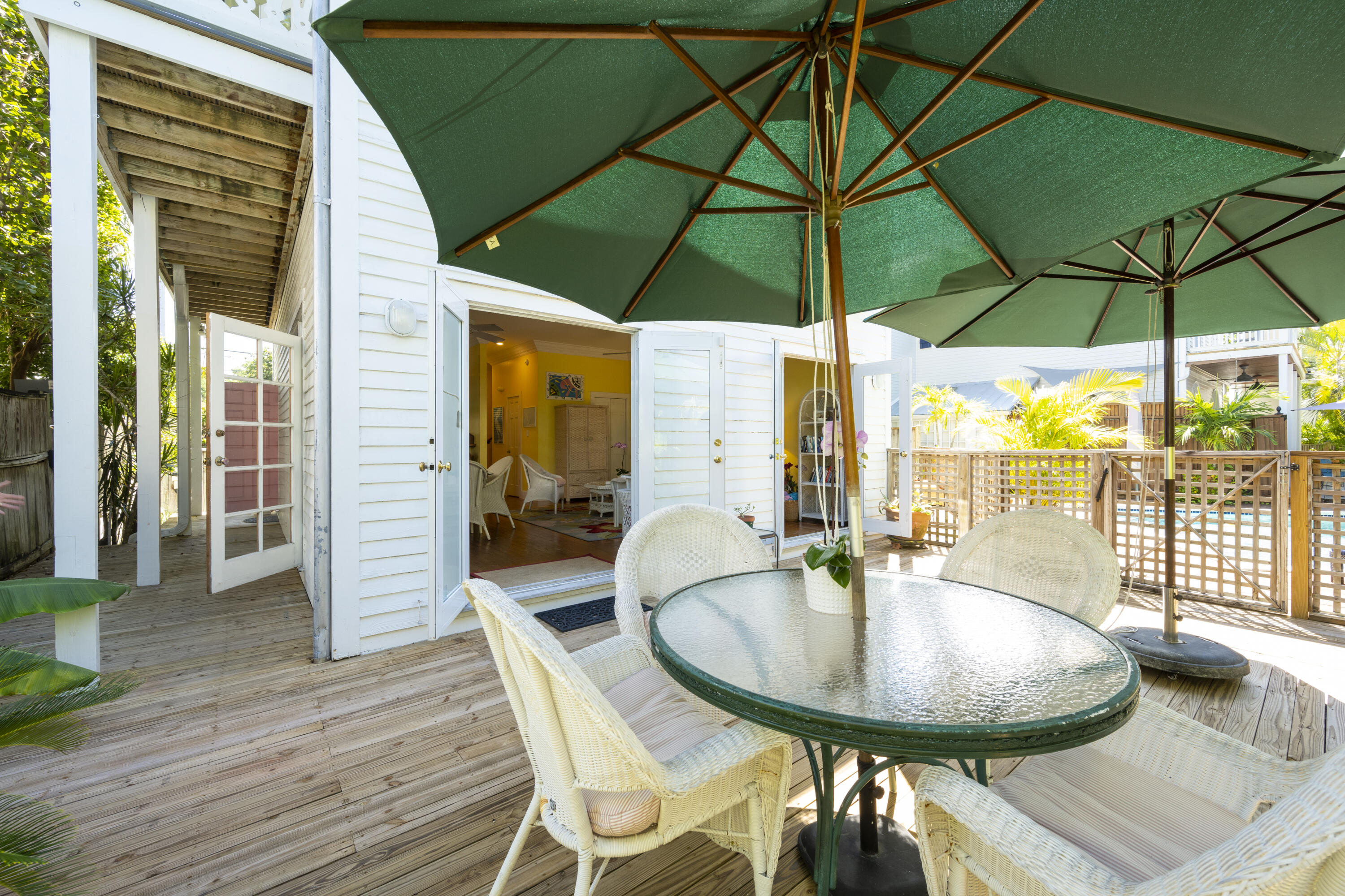 1003 United Street, Unit B Key West, FL 33040 - Photo 35 of 39 a table and chairs in the outdoor space