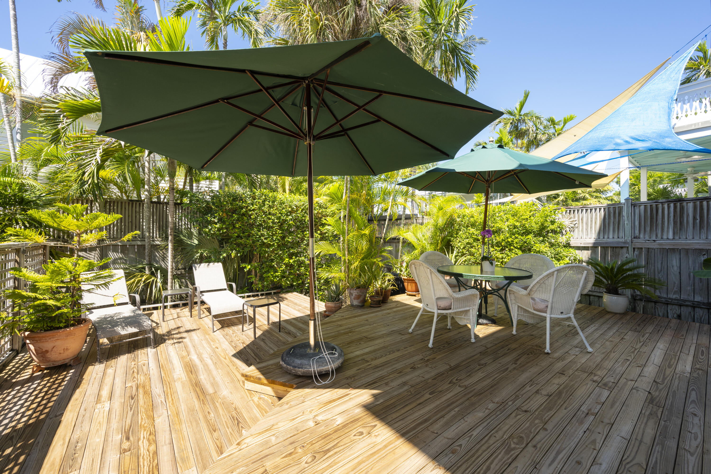 1003 United Street, Unit B Key West, FL 33040 - Photo 37 of 39 a view of an outdoor space with furniture and umbrella